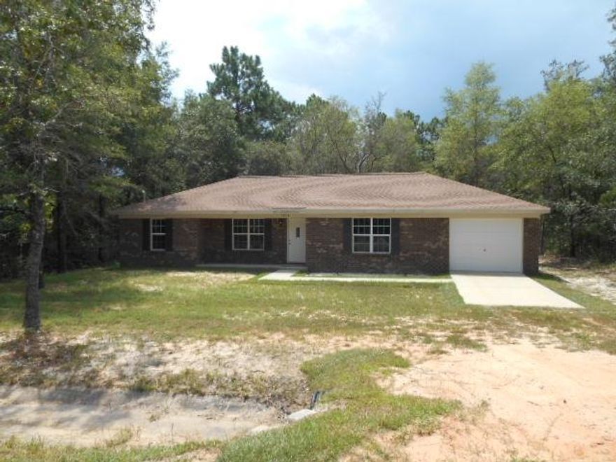 PRICED REDUCED, SELLER SAYS SELL and CLOSE by 10-31-2014. This home was built in 2013 and has never been occupied, so you get brand new! Country living but Close to everything. Front porch to enjoy the quietness. Open living and dining with cathedral ceiling. Tile Floors in Kitchen, Laundry and Bath rooms. Lots of cabinets space with ceiling high cabinets. Inside laundry area off kitchen. Master bedroom is a split floorplan for added privacy and convenience also has 2 closets. Large oversize Garage. ALL Brick exterior for easy maintenance. Buyer to verify any information.
