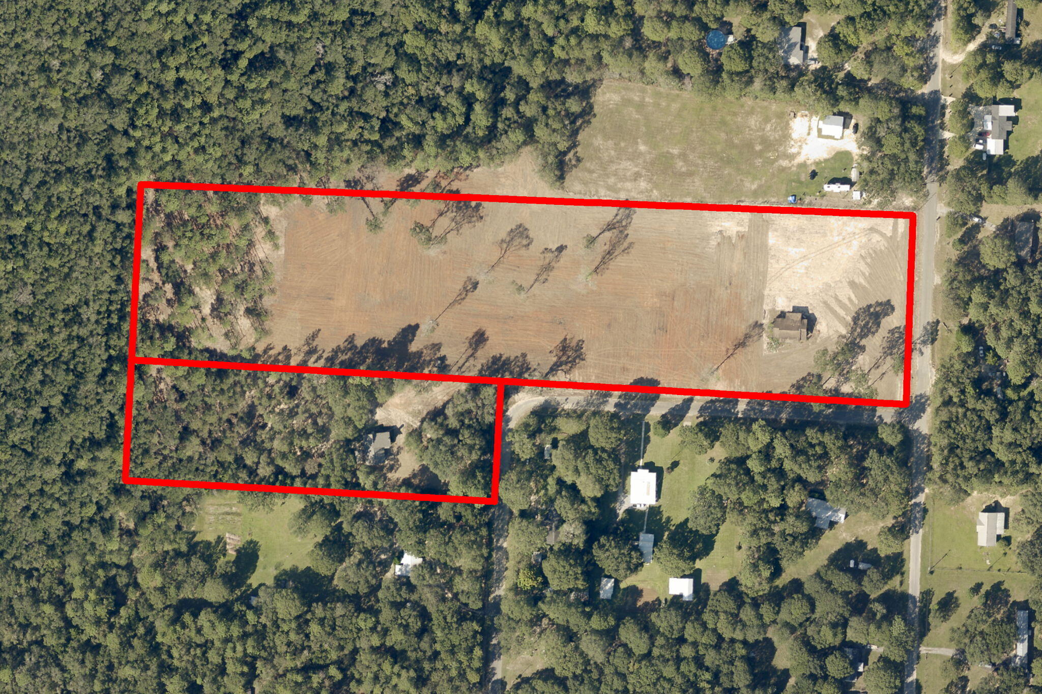 Unlock the potential of these TWO fully fenced parcels! With over 10 acres cleared, these parcels are ideal for builders and developers seeking a versatile property in a prime location. The property can be subdivided into up to 22 lots, offering ample space for a residential community. Located near the intersection of I-10 and Hwy 87, the land provides easy access to major highways, ensuring convenient transportation while offering a peaceful, rural setting. These parcels are zoned for Agriculture, Rural Residential and Commercial use, providing flexibility for a variety of development options. With city water available, these parcels are ready for immediate development. This is an excellent opportunity for builders and developers seeking cleared land with zoning flexibility, the ability to create a multi-lot project, and the added bonus of two existing structures. Sale includes both parcels 05-1N-27-0000-01401-0000 and 05-1N-27-0000-00105-0000. Don't miss your chance to bring your vision to life on this prime property!

