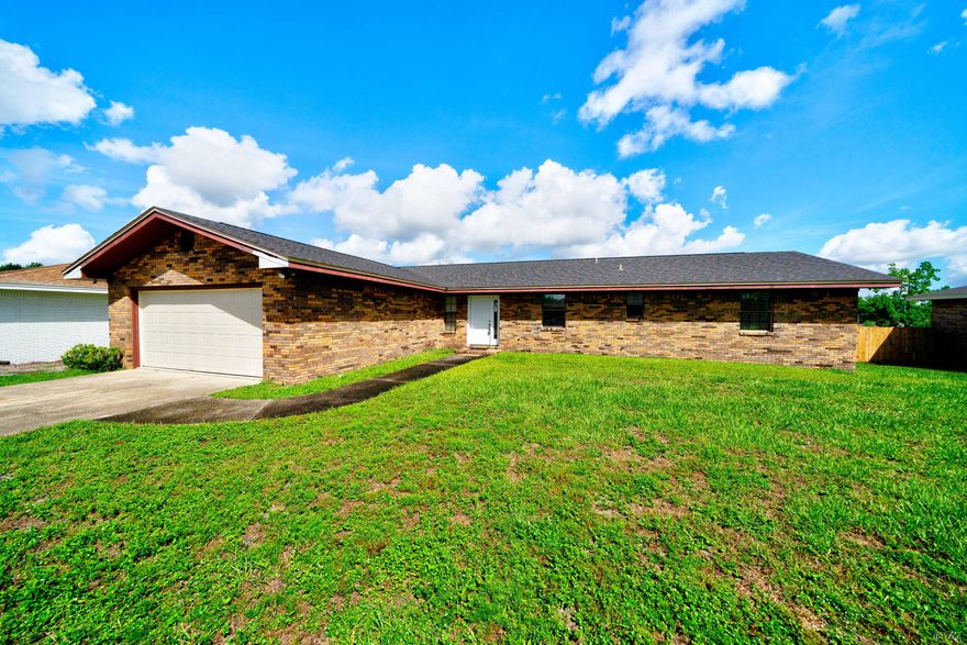 Beautifully updated 4 bedroom, 2 bath brick home on nearly half an acre located near TAFB! This spacious home features a welcoming foyer and sitting room as you walk in. This home also features an open kitchen and living room floor plan that makes hosting family and friends a breeze! The kitchen has been completely remodeled and features new stainless appliances, a kitchen island with storage, new counters, new cabinets, tile backsplash and modern lighting. This home also has a formal dining room with beautiful modern lighting. The living room features a brick fireplace and sliding glass doors that leads to the large deck and huge backyard. The spacious primary bedroom features double closets and a private en suite. The private primary bathroom features a walk-in shower.