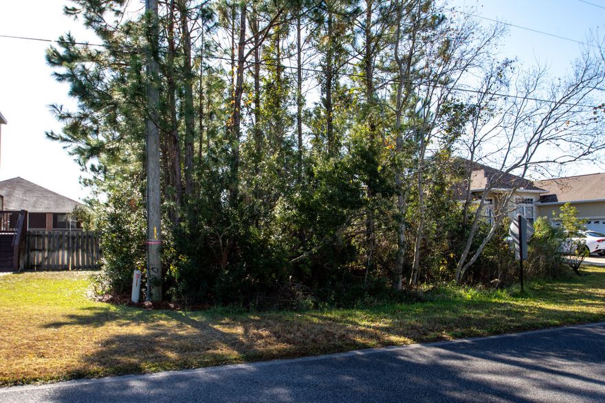 Excellent dry lot located In the highly desirable 'Sparking Waters' community within the Parrish Point s/d.Click on photos to discover the natural beauty of the area and the short distance to the Santa Rosa sound which will create gorgeous views of both the sound and gulf should you build a two or three story home on the property.Want a great lot and a great location, this is the one.