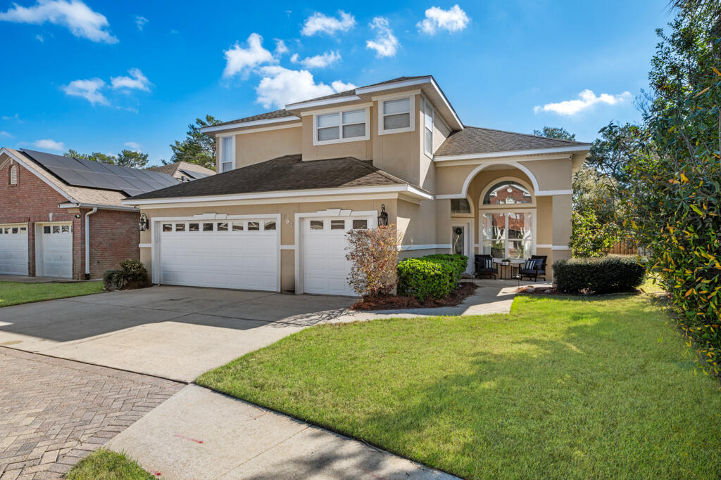 A Home That Has It All--And Then SomeTucked behind the convenience of Lowe's and Walmart, nestled between Hurlburt Field and Eglin AFB, lies a hidden gem--Bridgeport Colony. This gated community isn't just another neighborhood; it's a place where charm, quality, and convenience come together in perfect harmony. And at the heart of it, waiting to be discovered, is 787 Barley Port Lane.From the moment you arrive, the home makes a statement. The stucco exterior, manicured landscaping, and grand arched windows above glass French doors create a presence that's both elegant and inviting. A covered front porch welcomes you--an ideal spot for morning coffee or quiet reflection.Step inside, and the home opens up beneath soaring cathedral ceilings, where natural light pours through oversized windows, dancing off the real wood floors. The first living space and dining area are designed for both beauty and function, separated from the main living room by a striking flow-through fireplace, adding warmth and character.

But the heart of this home? The kitchen.

Perfectly positioned in the center of the main floor, this space is built for gathering. Cabinetry stretches endlessly, offering storage for every dish, every ingredient, every moment shared over home-cooked meals. Expansive countertops provide ample prep space, ensuring the kitchen is as functional as it is welcoming.

Just beyond, the primary suite feels like a private retreatspacious, serene, and thoughtfully designed. A tray ceiling adds a touch of sophistication, while the luxurious ensuite invites relaxation with its separate soaking tub, walk-in shower, double vanity, and a generous walk-in closet. And for those who cherish a quiet escape, the private access to the fenced backyard and covered patio makes this suite even more special.

Upstairs, the home continues to impress. A 90-degree staircase with elegant railing leads to three large bedrooms and a breathtaking open-air lofta perfect vantage point to take in the grandeur of the home below. Light floods the space, creating an atmosphere that's both airy and inviting.

And just when you think it couldn't get better, there's morea community pool within walking distance, ready for warm summer days and peaceful evening dips.

787 Barley Port Lane isn't just a houseit's a place to call home. A place where elegance meets comfort, where space meets warmth, and where every detail comes together to create something truly special.

Are you ready to step inside?