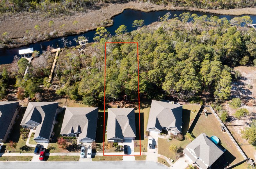 Motivated sellers - Almost half acre lot backing up to Preservation area, check.  Outdoor porch and deck, check.  Upgrades, check.  Great water view of Peach Creek, check.  Well maintained, check.  Open floor plan with split guest bedrooms, check.  Great opportunity to buy on the coveted Maddox Street area of Peach Creek.  Large master bedroom with double vanity master bath.  New hardwood floors, new backsplash, paint throughout, painted cabinets and upgraded hardware, and more!
