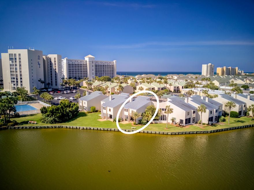 Exceptional value for a two-story, lakefront townhome in the landmark condominium coastal resort community of Shoreline Towers! The features include soaring ceilings, fabulous metal balustrades enhancing the staircase, wood-burning fireplace, and stunning views of a quaint courtyard and gorgeous lake. Please inquire for further details.