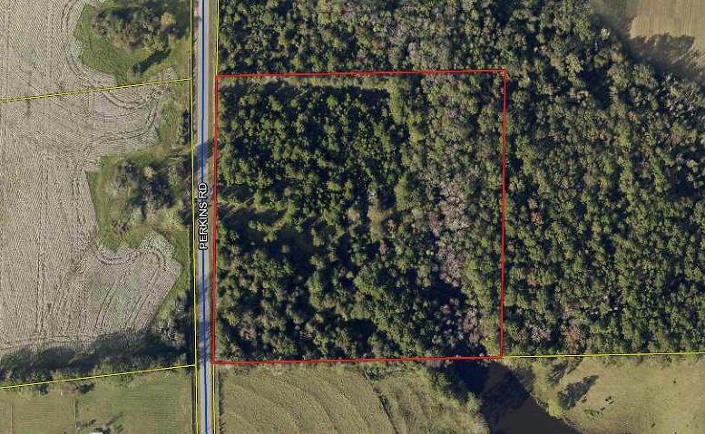 TEN beautiful wooded acres perfect for hunting, building your dream home or BOTH! This property is fully fenced and ready for your animals. At the Southeast corner of the property, there is a small wet area from the neighbor's pond. The seller has a current survey that reflects the flood zone in the corner.