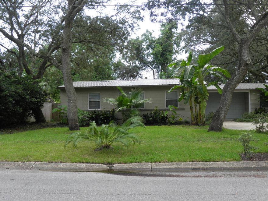 Accepting backup offers.  Under Contract with Contingencies.  MOVE IN READY!   RENOVATED 4BR/2BA cozy home.   Updates include 2016 METAL ROOF, 2016 wood grain TILE floors, 2016 water heater, updated copper wiring and fuse panel, vinyl windows & blinds throughout, 6 panel doors throughout, travertine tile bathrooms, galley kitchen & hardwood cabinets, 2016 professional landscape, 2018 wood deck, 2017 in-ground sprinklers, 2017 privacy backyard fence & newly painted inside and out.  Don't miss the extra large parking pad too!