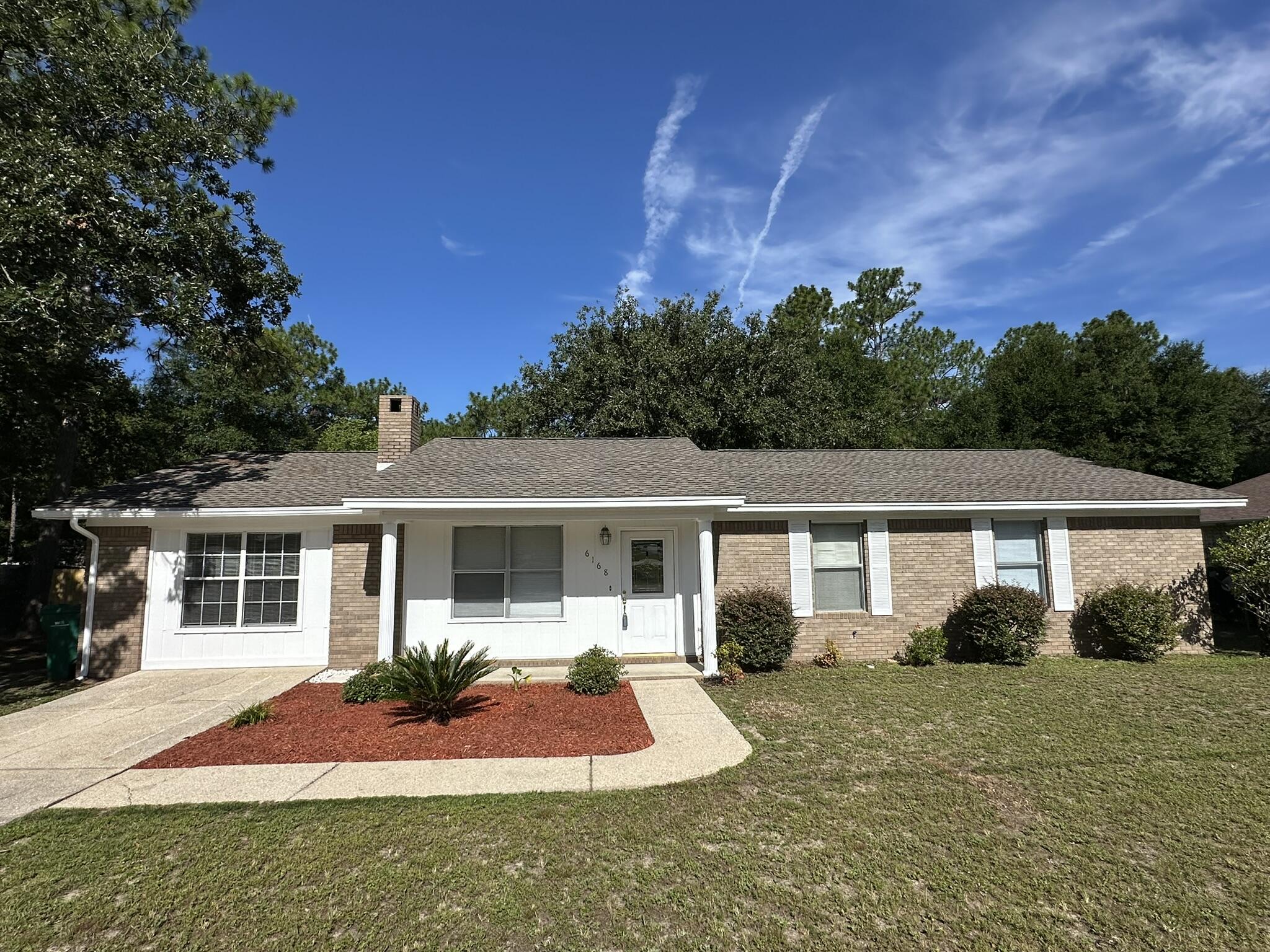 Well-maintained and move-in ready, this charming 3-bedroom, 2-bathroom home offers a desirable split floor plan and a spacious, open layout. VLP flooring runs throughout the main living areas, while the enclosed garage--currently used as a fourth bedroom or flex space--is comfortably carpeted. Situated on a level, generously sized lot with mature trees, the property offers privacy and room to spread out. The peaceful setting is ideal for relaxing afternoons, outdoor hobbies, pets, or gardening. Conveniently located just a short drive from local amenities, this home blends comfort with quiet living -- a must-see!