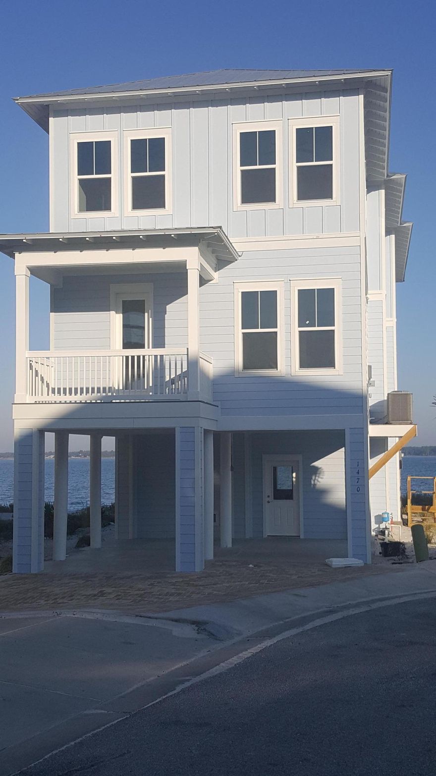 Wow...that really should be the only word in this description. The amazing Bermuda floor plan, overlooking the water, with multiple decks overlooking the water; is a stunning representation of live in Florida. This is a very limited opportunity, in this great community with an amenity; a pool area, with hot tub, firepit, and restroom area, complement the community, and with a gate that closes in the evenings, it comes with the feel of community. This great lot and floor plan are unbeatable! An open concept kitchen/dining/family room area on the main living floor can bring a family together, and the luxurious bedrooms, with 2 ensuites included, really turn the tide toward By the Sea. Don't miss this opportunity. Deckspace, comfort, elegance, waterfront, and a great price! Going soon!