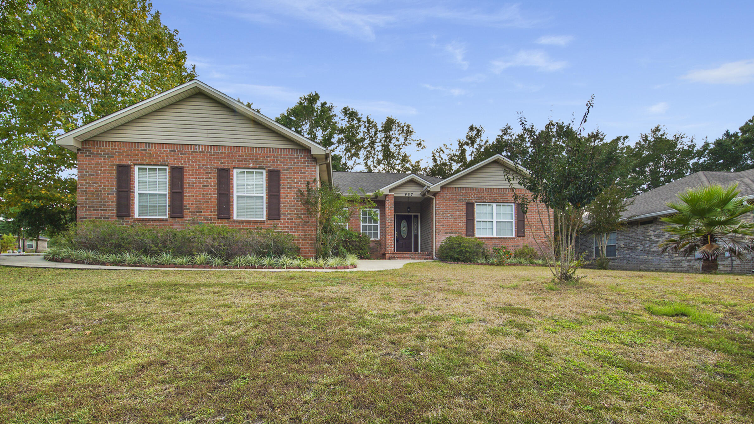 Impressive Price Improvement! Charming brick 4 bed/2 bath home is conveniently located in popular Magnolia Lake Estates, inside the city limits of DeFuniak Springs and convenient to schools, shopping, parks and a quick 35 minutes to the beaches. Situated on a corner lot with a cozy, shady back yard and side entry garage. Neat as a pin and lovingly cared for with a split floor plan and vaulted ceilings, making it feel open and even larger than it is. Hardwood floors in the living areas with carpet in the bedrooms. Lovely, large master suite with double vanity, new cultured marble shower and jetted tub. Home is beautiful and well maintained. Magnolia Lake is a small quaint neighborhood with one entrance plus a gazebo/picnic area with access to the lake for all homeowners.