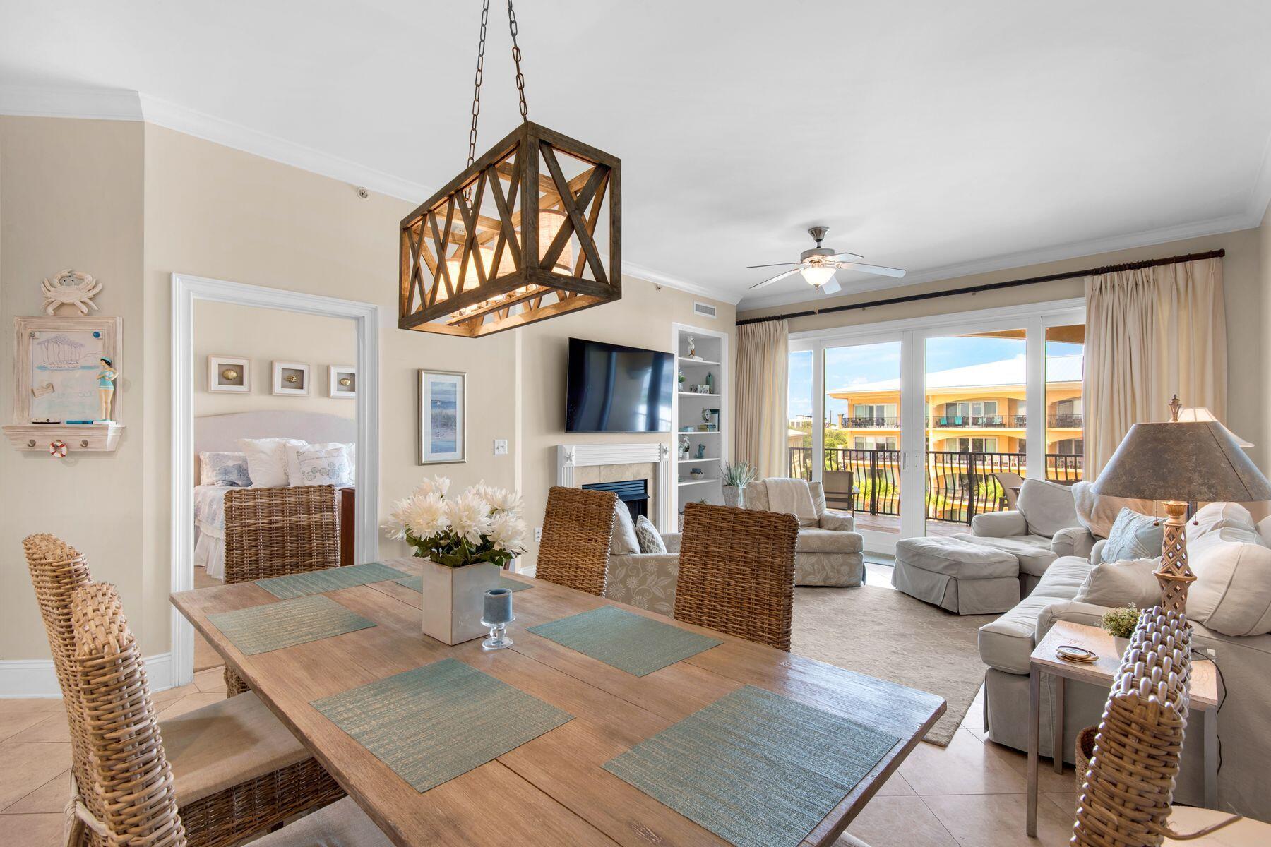 This exquisitely furnished poolside condo in the exclusive gated community of Adagio in Blue Mountain Beach offers a perfect marriage of privacy and luxury. Situated on the top floor of the desirable G building, G403 provides stunning rooftop views of 30A and overlooks the tranquil Adagio pools. The condo features three spacious bedrooms and three full baths, with an additional bunk room cleverly designed off the hallway to create a fourth sleeping area. The interior is a testament to fine craftsmanship, featuring diagonally laid travertine floors, granite countertops and custom cabinetry. The gourmet kitchen is equipped with stainless steel appliances, a tumbled marble backsplash and a built-in ice machine, making it as functional as it is beautiful. The living area is highlighted by a gas fireplace, built-in TV cabinet and custom bookcases, creating a warm and inviting space. Recent updates include new light fixtures and modern furnishings, ensuring the condo is move-in ready and stylishly up-to-date. Although this home has never been part of a rental program, similar units have shown significant income potential, highlighting the value of this residence as both a personal sanctuary and a smart investment. Adagio offers a wealth of amenities, including a beachside heated pool, a larger pool and hot tub in the common area, a state-of-the-art fitness center, an onsite spa, beach service and bike rentals. The condo is just steps away from the private Adagio beach, providing easy access to the pristine sands while offering the seclusion of being set back from the beachfront. Its prime location also puts you close to popular 30A spots like Gulf Place and Grayton Beach, making it an ideal choice for families seeking a second home or a high-potential vacation rental. Adagio - played purposefully, leisurely, slowly.