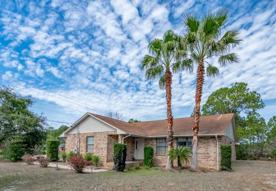 ***SELLER IS REPLACING ROOF*** Welcome Home! Don't miss this fantastic 4 bed, 2 bath brick home located on over a half acre corner lot in Holley By The Sea. Thoughtfully appointed with split floorplan, this home features vaulted ceilings, tile and parquet wood flooring (no carpet!), and a screened porch overlooking the expansive backyard. The two car side-entry garage has ample room for cars and tools or lawn equipment. Bonus: the homeowners have connected to public sewer, so no septic here! You'll enjoy the world-class amenities offered by the HBTS Recreation Center, to include pools, playground, tennis courts, fitness center, campground, pier, boat launch, beach club house, and youth center.