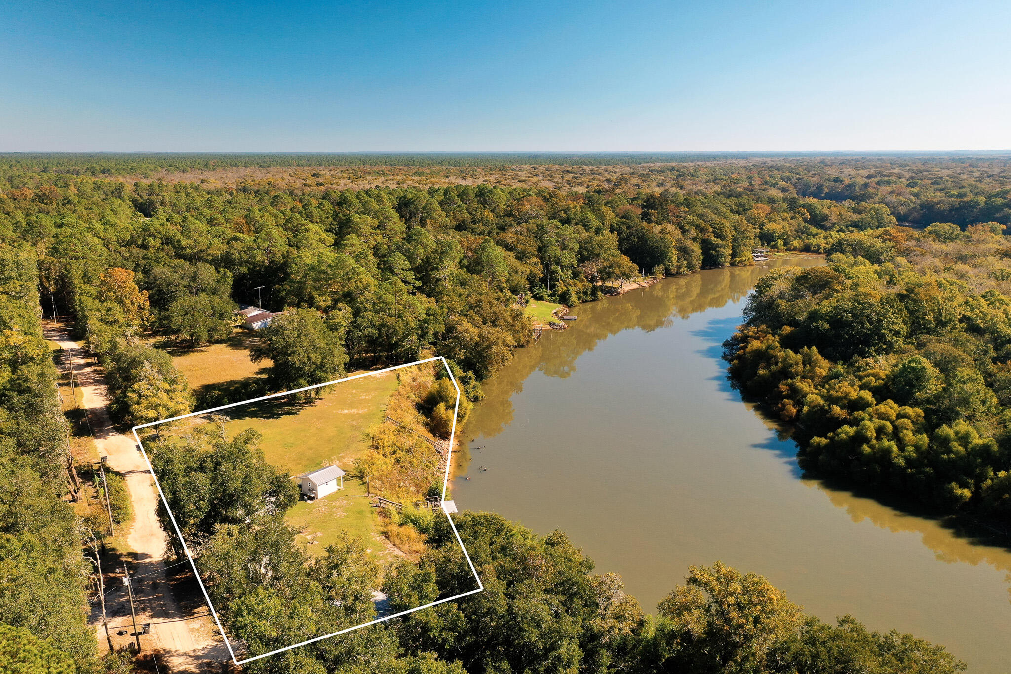 Welcome to 117 Reddick Loop in Ponce de Leon, Florida, a peaceful slice of land surrounded by mature oaks and natural beauty. Set on nearly 0.67 acres, this property offers privacy and potential in one of Northwest Florida's quietest corners.Positioned on a secluded loop with gentle elevation above the nearby river valley, the setting feels calm and open, with just enough space to create something meaningful. With well, septic, and power connections already in place, the groundwork is ready for a new owner to build or place a home without the typical hurdles of undeveloped land.The area is known for its untouched landscapes, freshwater springs, and easy access to outdoor recreation while remaining within reach of nearby towns and the beaches of South Walton. Whether you're planning a permanent home, a weekend retreat, or a simple investment, 117 Reddick Loop offers the kind of natural setting that's increasingly hard to find; quiet, authentic, and ready to make your own.