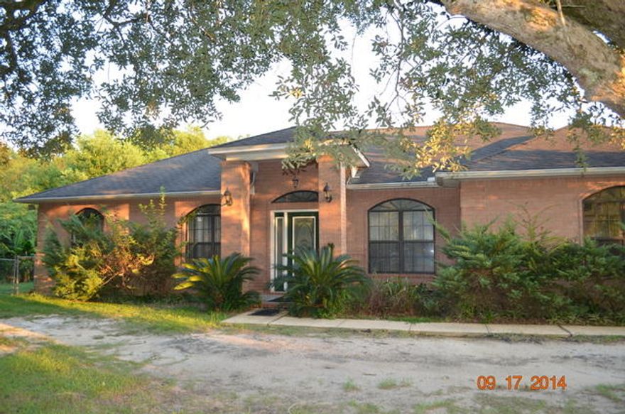 Built in 1997 this all brick contemporary style home is large, conveniently located and poised to sell. Right at 1950sf this split bedroom designed home has three bedrooms, 2 baths and laminate floors throughout. The backyard if fenced and the covered lanai has been screened. The great room has vaulted ceilings, fireplace and french doors that open to the lanai. The kitchen has all appliances and and though this property is selling in as is condition, the home is in average condition and is basically move in ready. A great home in a great location and priced to sell!