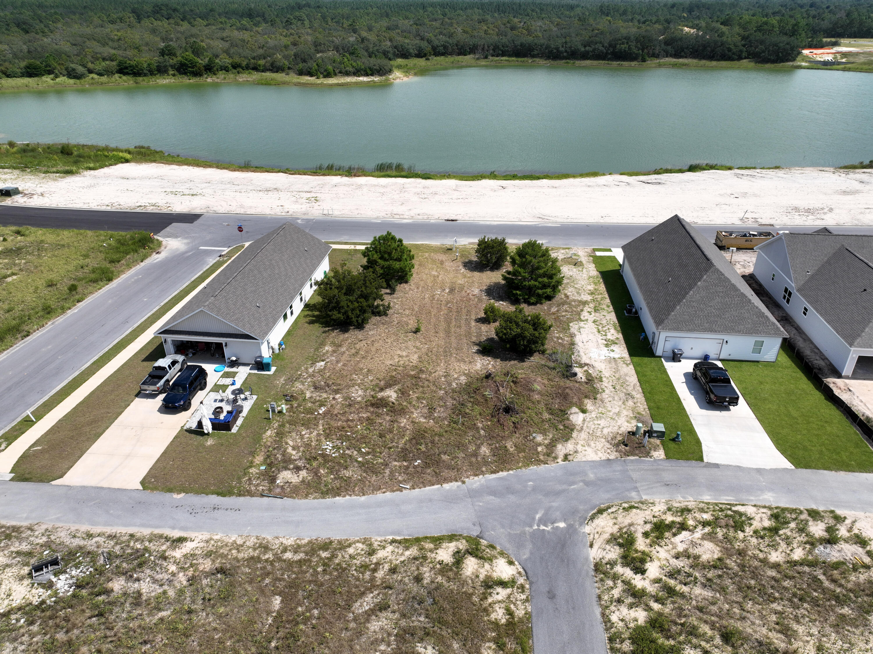 **BUILDER/MULTI-LOT DISCOUNT**Discover an extraordinary opportunity to acquire not one, but two valuable lots at a significantly reduced price. This unique offering includes the corner lot at Arrowwood and Huckleberry (MLS #977834) for a combined price of $139,000. By purchasing these two lots together, you benefit from a consolidated transaction and a price that would not be available for individual sales. 00 Bluebeech is a lake adjacent lot conveniently located off Hwy 331 with quick access to local schools, parks, shopping & restaurants. Only 16 miles from some of the most beautiful beaches in the World! Owl's Head Subdivision offers walking trails, a lake and large green space. Unobstructed lake views! Don't miss out on this unique chance to secure a strategic investment or a dream location for your future home. This offer is available to anyone, so act quickly to take advantage of this special pricing.
