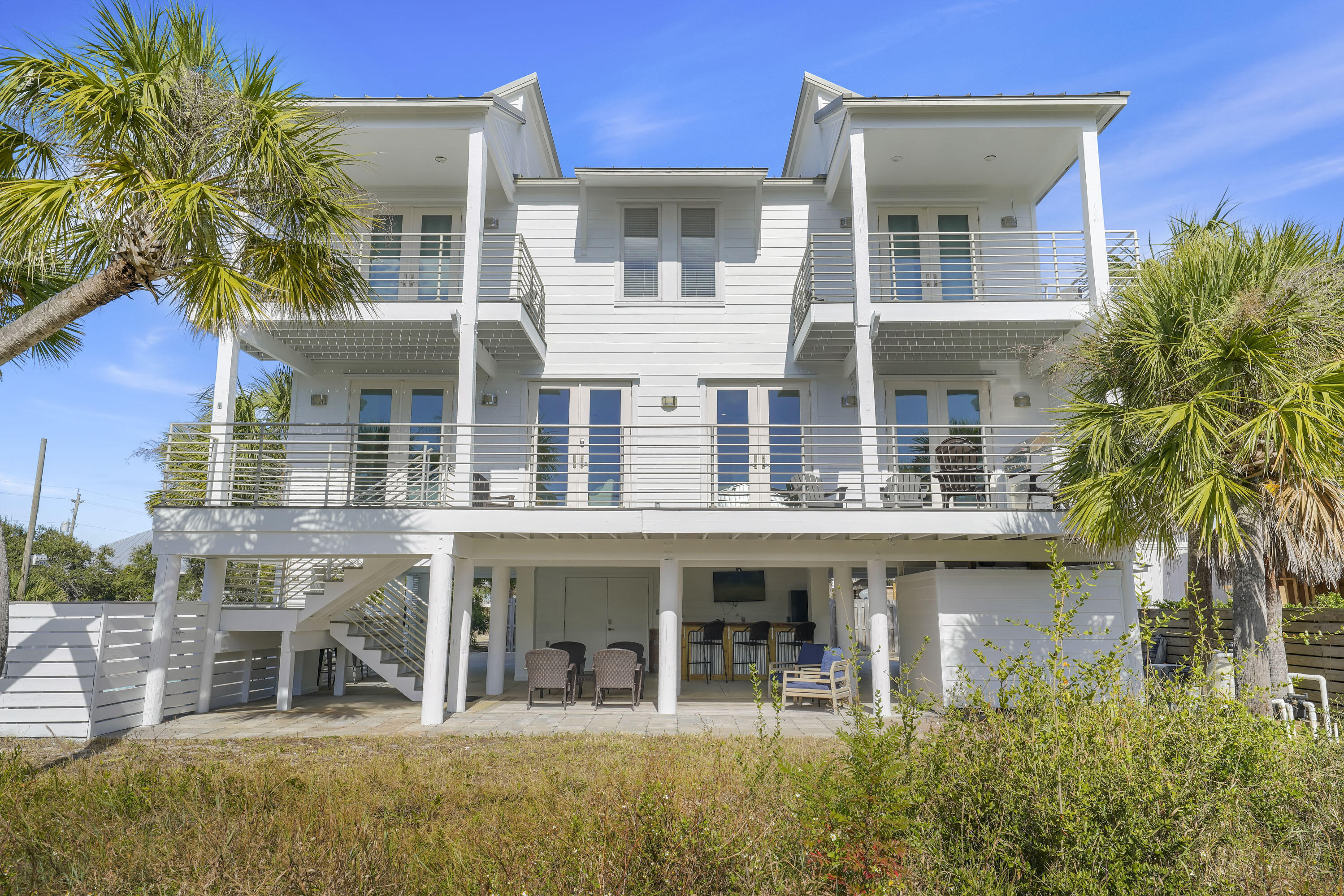 Located in a gated community in a quiet area of Miramar Beach, this coastal-style estate is just a short 2 minute walk to your deeded beach access. An abundance of balcony space along with its open living and dining area make this home a great place for gathering and taking in the gorgeous Gulf views - which can be seen from all 4 bedrooms as well as the living and dining areas! Outside, you'll be greeted with a private pool with a relaxing waterfall, and ample lounging.