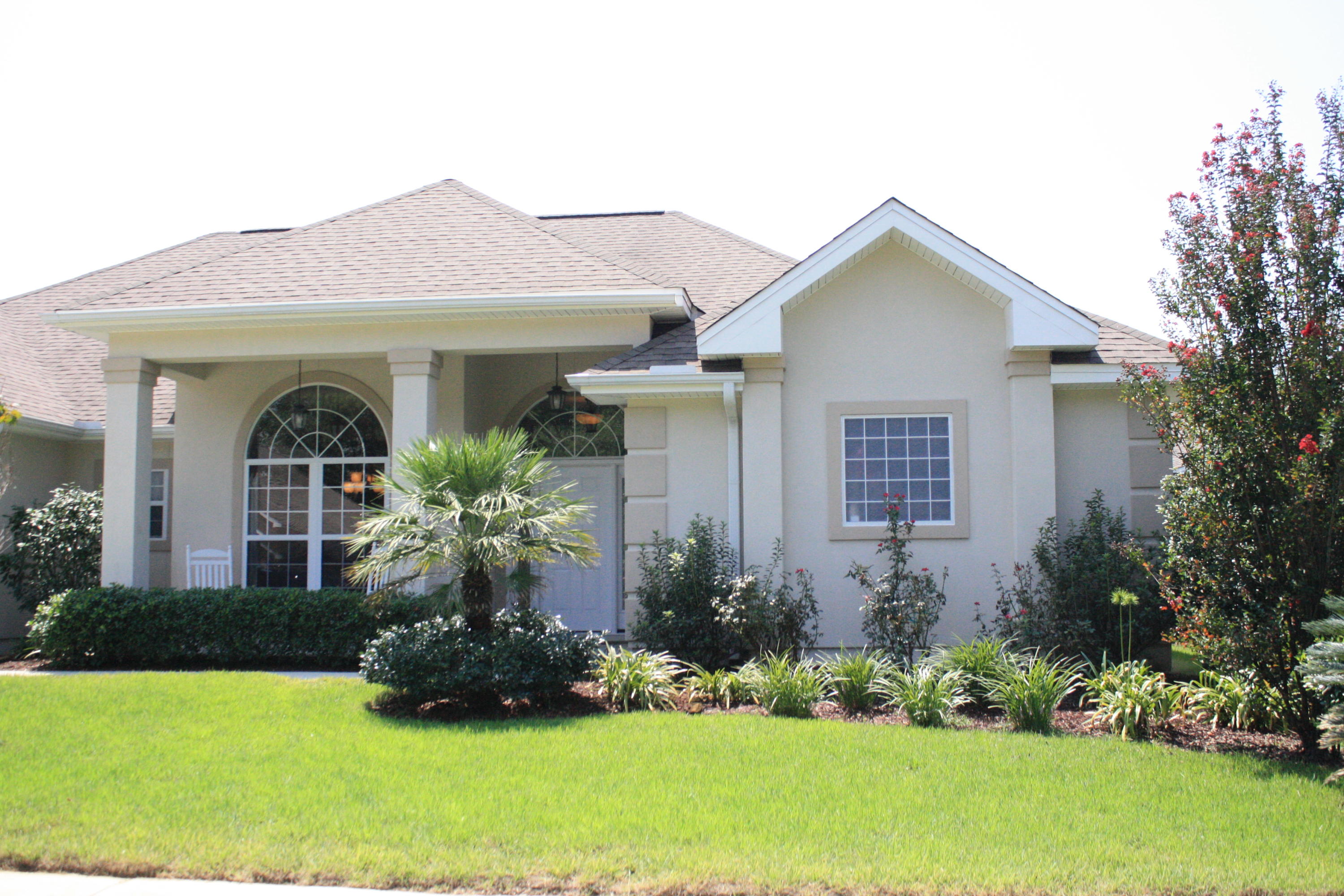 Gorgeous 4 bedroom, 3 full bath 2,677 sq. ft. custom-built home showcases superior craftsmanship in Rocks Cove subdivision in Bluewater Bay. The kitchen features granite countertops, stainless appliances and upgraded cabinets. There are large tile floors throughout with carpeted bedrooms. The master bath has a beautiful tiled walk-in shower with rain shower heads and a separate whirlpool tub. The master bedroom has a trayed ceiling with recessed lighting. There is crown molding throughout and a central vacuum system. This split bedroom, open floor plan has high ceilings and rounded corners. This home has spray foam insulation for savings of up to 50% on you power bill!