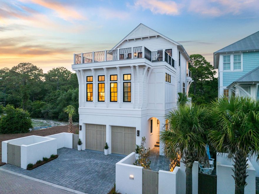 Tucked behind the gates of Seanest Village in Seagrove Beach, this brand-new residence at 119 Sand Oaks Circle is a curated blend of refined coastal architecture and high-end design. With Gulf views from the rooftop deck, forest vistas off the bedrooms, and a walkable location to both Seaside and Greenway Station, this home checks every box for a legacy 30A retreat.Designed by Gregory Jazayeri and built by the expert team at Focus Construction, the home showcases cypress accent ceilings, 10' coffered details in the main living space, and a vaulted master suite--elevated by a design-forward interior palette thoughtfully curated by Cote Studio. Thermador appliances, custom Italian-style cabinetry, solid core doors, and black Delta fixtures continue the theme of understated luxury throughout. Spread across three levels, the home features four bedroomseach with its own ensuite bathalong with laundry rooms on both the second and third floors. The first floor includes a private guest suite and a full-over-king bunk room, while the second level offers a generous guest suite with a private balcony overlooking the state forest. On the third floor, the primary suite is a peaceful escape with vaulted cypress ceilings, a spa-like bath, walk-in closet, and its own covered terrace among the trees. A full wet bar with beverage cooler, ice maker, and sink opens to the rooftop deckperfect for evening gatherings around the gas fire feature with views of the Gulf.

The craftsmanship extends outdoors with a solid concrete first floor, cement board siding, custom millwork exterior gate, lush landscaping, and low-voltage lighting. A large covered summer kitchen, exterior gas lanterns, and a two-car garage with EV charging complete the offering.

Owners in Seanest Village enjoy deeded beach access, a resort-style community pool, and a central location with convenient access to the very best of 30A. Whether you're entertaining from the rooftop, relaxing on the forest-facing balconies, or strolling to Seaside for dinner, 119 Sand Oaks Circle offers a rare blend of privacy, luxury, and coastal ease.