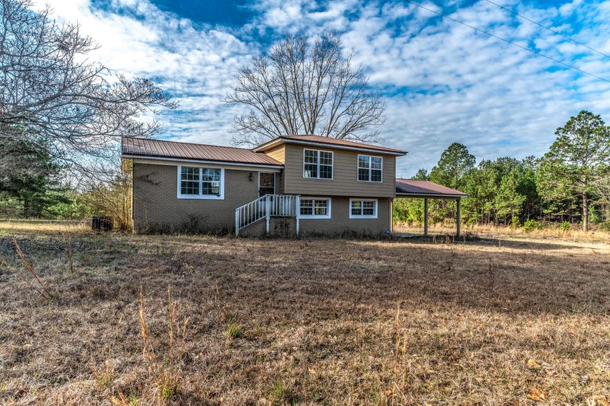 A few years ago this home was completely remodeled inside and has been maintained well by the owner. Wood laminate floors and crown molding throughout the whole house besides tile in the bathrooms. The exterior has high efficiency windows and a metal roof. Also a nice two car carport and in the back a 12x22 deck. All sitting on 17.37 acres of land. Come check this great home out today and don't miss out.