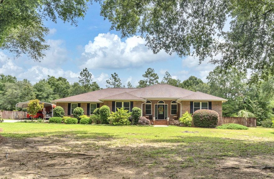 Welcome to this beautiful all-brick, four-bedroom, two-bath home situated on nearly an acre in a peaceful, rural-style setting surrounded by mature trees and lush foliage. From the moment you enter, you'll notice the elegant architectural details, including bull-nose corners, and arched doorways. The spacious great room and dining room feature real hardwood flooring, while tile flooring is found in all wet areas and the foyer for durability and easy maintenance. Built-in shelving and a designated space for your TV in the great room offer both functionality and style. The kitchen boasts abundant cabinetry and a charming bay window in the breakfast nook, perfect for enjoying your morning coffee. The laundry room is conveniently accessible from both the kitchen and the master bath. A heated and cooled bonus room offers flexible spaceideal for a recreation room, man cave, or home office. Across from the detached garage and carport, you'll find a mud room with a deep sink for added convenience Step outside from the living room onto a covered porch with eye-catching Mexican tile, overlooking a sparkling clear 36'x16' oval pool, fire pit, large patio, and grilling areaperfect for entertaining or relaxing with family and friends. This meticulously landscaped property also features TRIPLE PANE impact windows for energy efficiency and peace of mind. Located less than 40 minutes from the sugar-white sand beaches of Northwest Florida, you'll enjoy easy access to deep-sea and bay fishing, world-class golf, boating, shopping, dining, and more. Don't miss the opportunity to make this stunning home your own!
