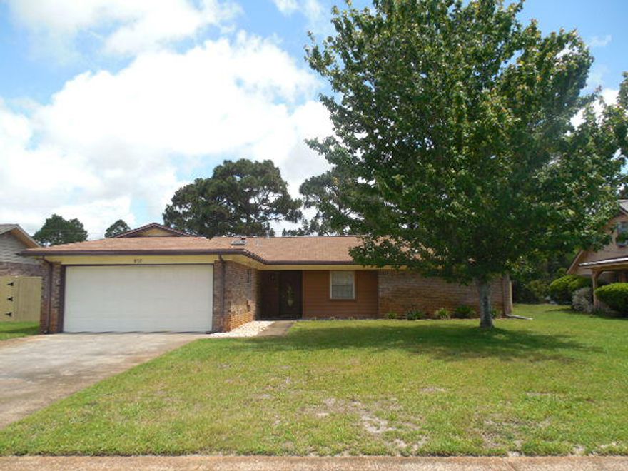 MUST SEE! Beautiful all brick home has private wooded area in back yard. Great location! This home is located close to base, shopping & schools. Spacious & open living room with beam cathedral ceiling, gas fireplace and beautiful wood laminated floors-see photos. Kitchen remodeled in 2010 has custom solid oak cabinets, quartz solid counter tops, smooth top stove, built in microwave, pantry & tiled floors. There is a formal dining room & an eat-in breakfast area with built-in cabinets for additional storage. Large master bedroom with walk-in closet & beautiful wood look tile floors. Beautiful wood laminated floors & tile throughout most of home. Plenty of parking with two car garage & work bench. Whole house generator is a great essential! Don't miss seeing this home and great subdivision!