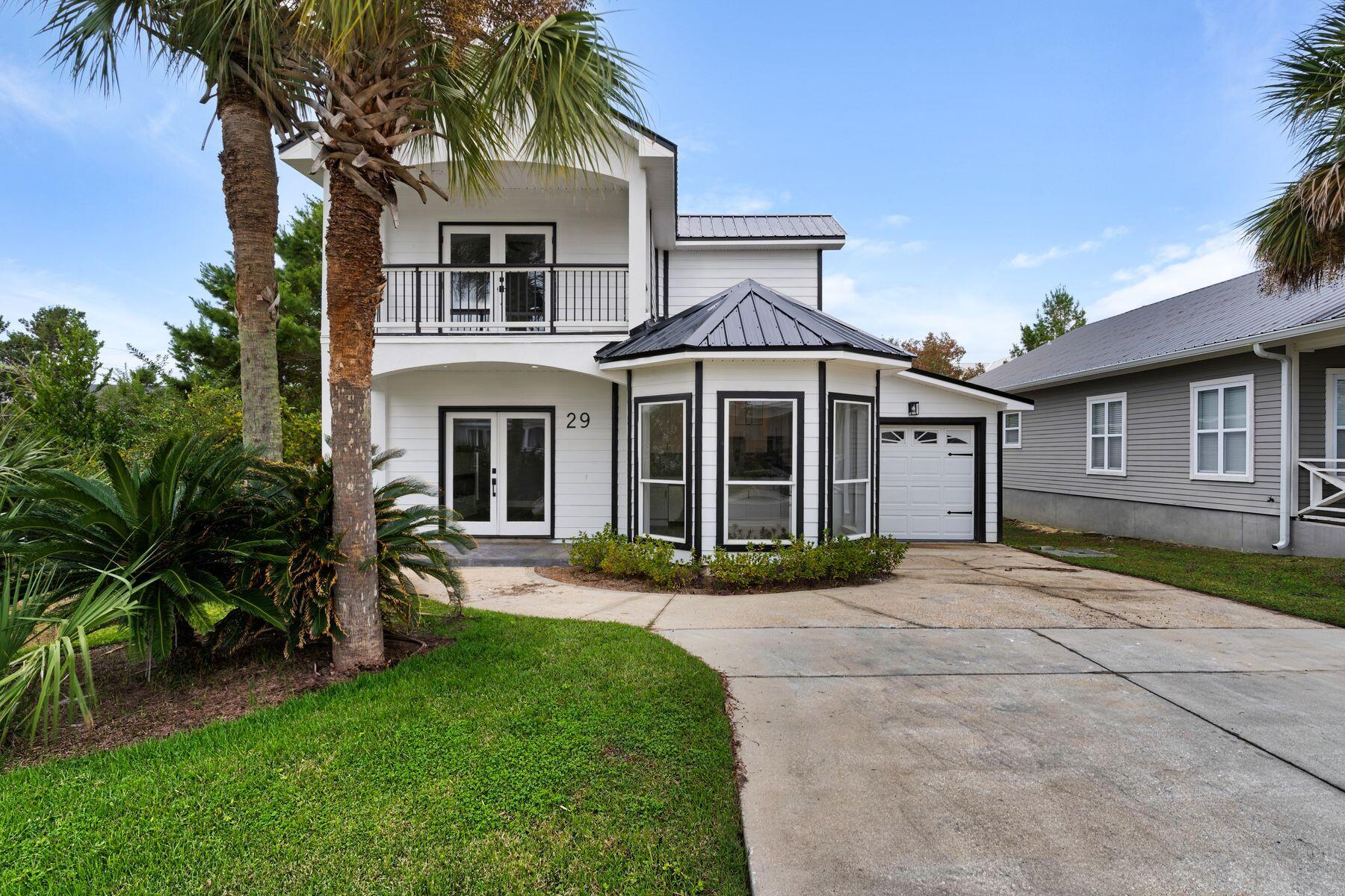 Welcome to Ventana Dunes, an impeccably renovated gem nestled in the heart of Blue Mountain Beach. Ideally located as the first home off 30A on Ventana Boulevard, this stunning property combines modern luxury with coastal charm, steps away from the 30A walking path and less than a mile to public beach access.  This three-bedroom, two-and-a-half-bathroom home has been completely transformed with thoughtful upgrades. A sleek black aluminum roof, new composite decking and fresh exterior paint add striking curb appeal; inside, every detail has been refreshed. New flooring, custom lighting, quartz countertops, updated cabinetry and modern appliances adorn the living spaces. Bathrooms have been elevated with a soaking tub, walk-in shower and designer fixtures. Dual-access points... Dual-access points lead to the expansive outdoor deck, perfect for entertaining  from private gatherings off the master bedroom to more significant celebrations via the main living area.  

Off-street parking for up to four cars ensures convenience, while underground utilities offer a seamless aesthetic. The home is move-in- and rental-ready, with estimated projections showcasing its potential as a lucrative vacation investment.  

Ventana Dunes offers an inviting community pool just a short stroll away and easy access to Blue Mountain's beloved eateries, shops, and stunning gulf views. With its prime location, high-end renovations, and short distance to convenient airports, this home is the perfect blend of luxury and opportunity.  
