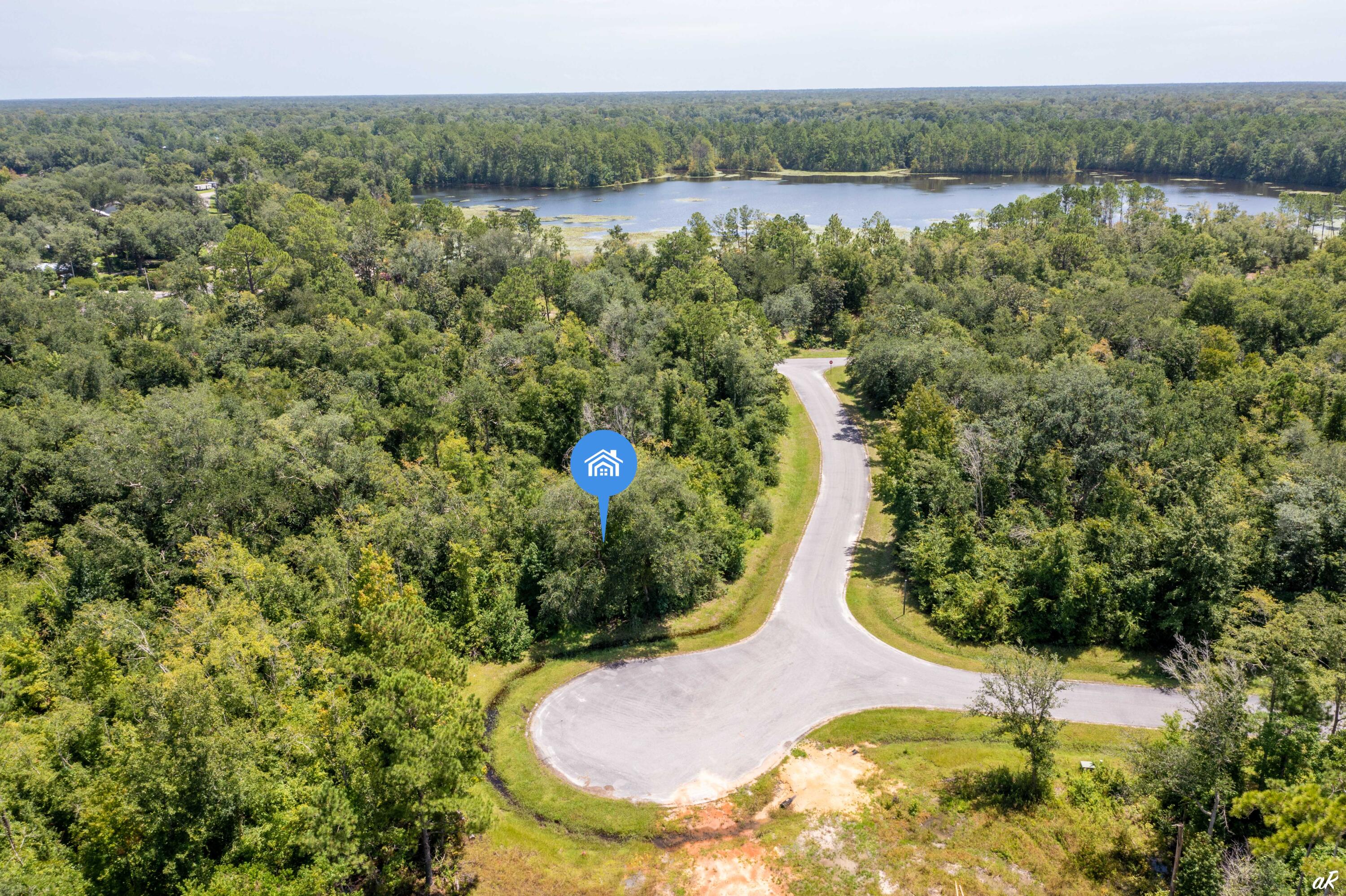 Opportunity tucked back off Seven Springs Road, this lot is a little over a half acre and ready to be developed. Ready for you to design and build your dream home in the relaxed little town of Wewahitchka. Minutes away, Dead Lakes offer some of the best freshwater sport fishing in the nation and are sure to provide anglers with enjoyable fishing days. This opportunity to own your personal haven away from it all will not last long. Take a look, wander around the city's downtown Lake Alice Park and make an offer today if this is your slice of serenity.