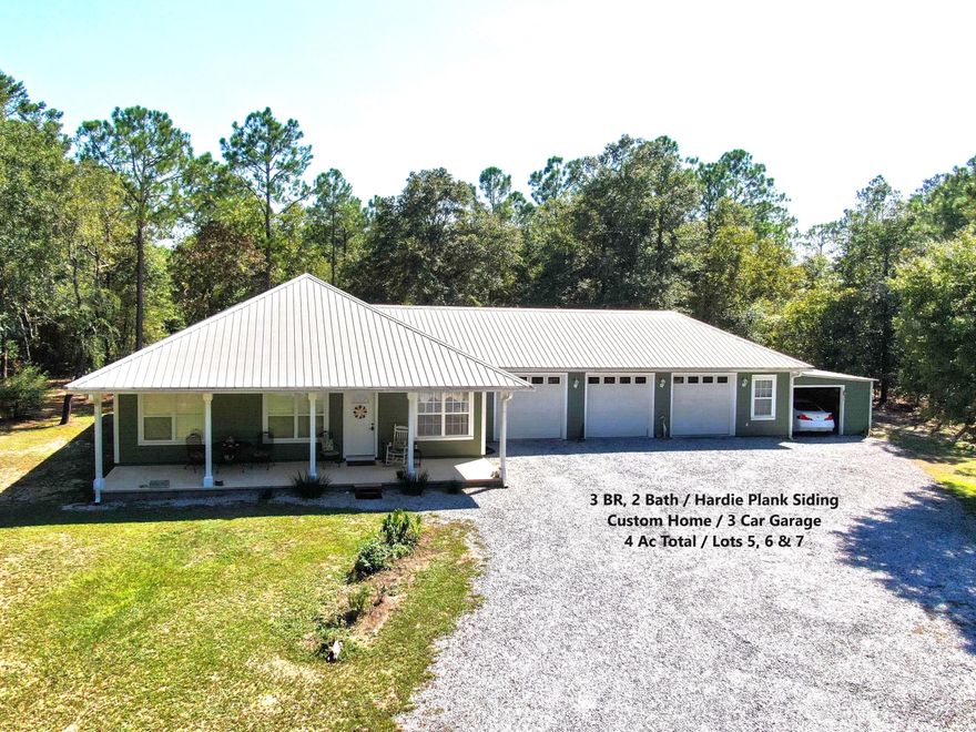 You'll want to put this custom home on 4 acres on your must see list! Home features include granite countertops in kitchen; Hardwood floors in living, dining & hall; Title in kitchen & baths; Carpet in bedrooms; Walk-in shower in master bath; Master BR opens out onto screen porch; 3-car garage plus attached carport for mower & lawn tools. Ext. features include covered front porch; Screened back porch; Spacious back deck with built in bench & covered grill area. This 4 acres includes two parcel IDs (home on l.3 ac...lot 7 & adjoining two lots...Lots 5 & 6, for the additional 2.7 ac). This could be a great opportunity for the extended family, or just combine the parcels for a 4 acre homestead. This is a great location just minutes to Walmart, I-10, shopping & dining. A definite must see!