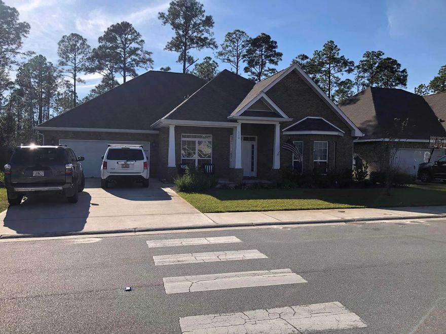 Wonderful opportunity to buy an incredible one-story 5 bedroom with a large flex room in the front that could be an office or a 6th bedroom (if wall closet is added), as well as 3 full baths!  This all-brick home built in '20, is in the highly desirable Peach Creek Subdivision offers 3,117 sq ft of heated and cooled space that boasts special features such as painted cabinetry, granite counter tops, and vinyl plank floors in all the main living areas! Your home was upgraded with a black & white diagonally tiled backsplash and the flex room was upgraded with a wooded design on one wall with a shelf for decorative items. The plumbing offers brushed nickel fixtures and you have designer lighting throughout the home. The backyard was upgraded with a separate shed, for you... (See More) to store your mower and tools for the yard. The patio was also expanded significantly passed the screened area to allow for BBQs and sitting in the yard.  Additional insulation was installed above the garage in the attic area, too. Your covered back porch was screened in by the sellers, which allows you to admire the private setting of the yard, without being bothered by insects.  This yard backs up to a preserve, so no additional homes will be built behind your home, affording you more privacy! The exterior has a full irrigation system and the yard has been professionally landscaped!  Make your appointment, TODAY, to see this lovely home!  You are never far from the white sandy beaches of the Emerald Coast! Cheers!  MLS - 941036