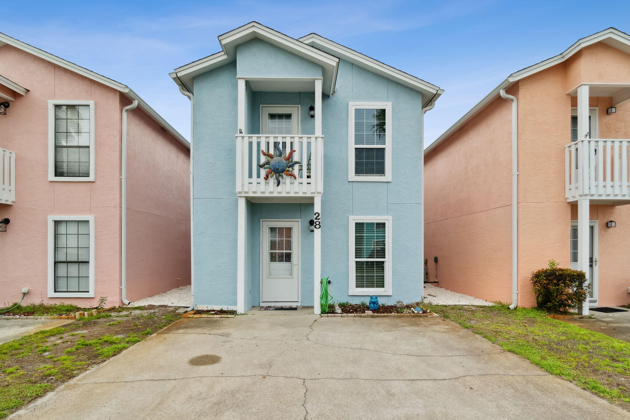 Fully furnished 2 bedroom 2.5 bathroom townhome with new roof in 2019 and newly painted exterior. Walk into a beautiful open, bright living area with a eat-in kitchen and breakfast bar. The home features 2 spacious bedrooms upstairs with balconies, living area, dining room and kitchen downstairs. It has a screened porch with outside shower, extra storage, and washer/dryer in laundry room and private beach patio for grilling or just hanging out, ideal to relax after a long day at the beach. The kitchen has a great set up with plenty of counter space and excellent for entertaining. Master bedroom has screened balcony looking out at the GULF. Upper deck enclosed with a great view. The property is located in Sand Castles West complex featuring two pools.