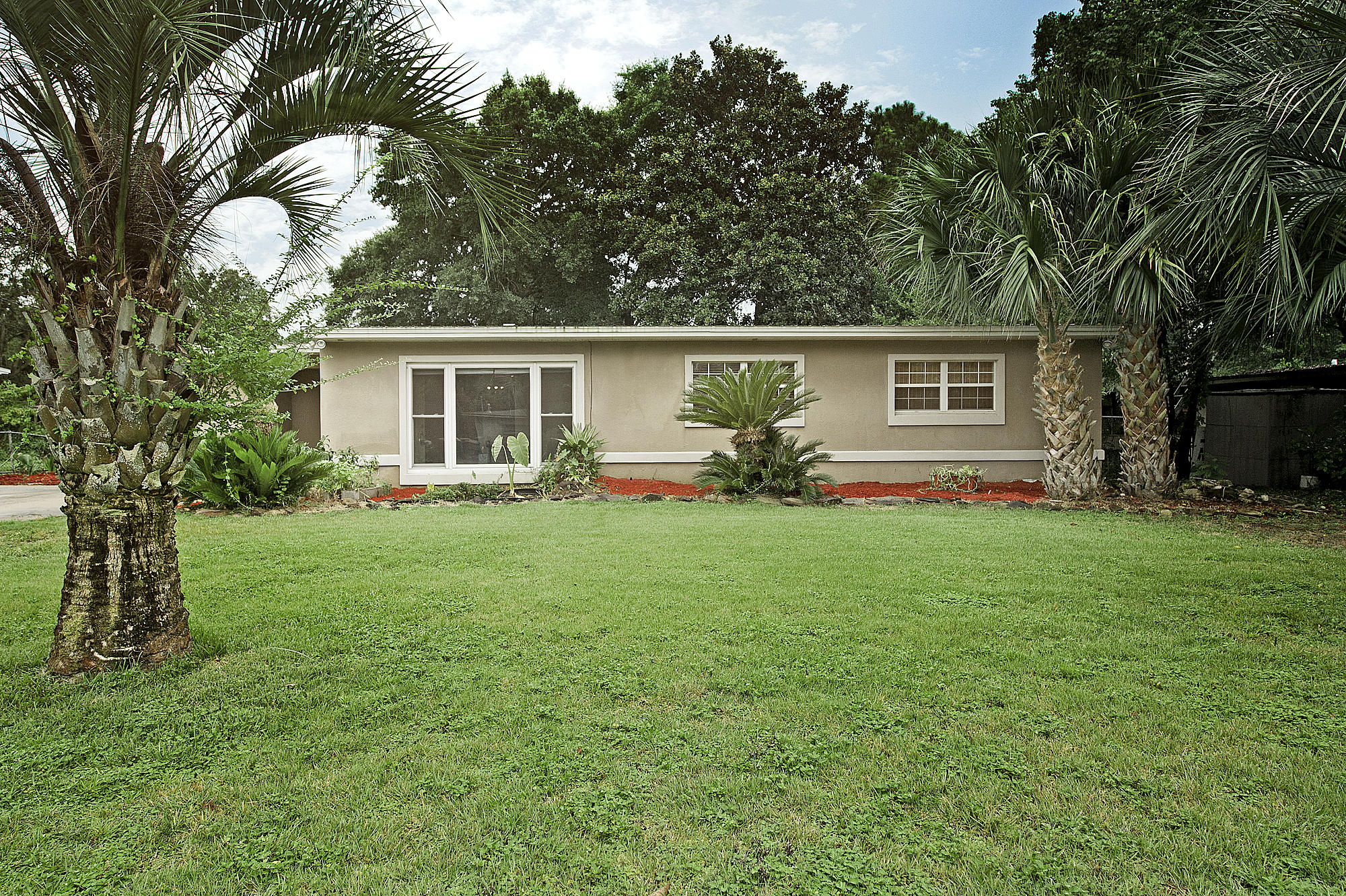 Cozy home close to military bases, beaches and a park with lots of activities. This home is within a 1/2 mile from Ferry Park. As you enter the front door you are welcomed by the family room with new vinyl plank flooring which extends throughout most of the home. The master suite has two closets and the bathroom has been updated. The kitchen features granite counter tops and stainless appliances. The lovely fireplace has an antique mahogany surround and is the focal point of the living/dining room which is open to the kitchen. The inside laundry room has lots of storage space. The large fenced in back yard has a covered patio and a deck for outdoor enjoyment. Enjoy fresh oranges from your own tree. The metal roof and HVAC unit were replaced in 2014. The shed is being sold ''AS-IS'