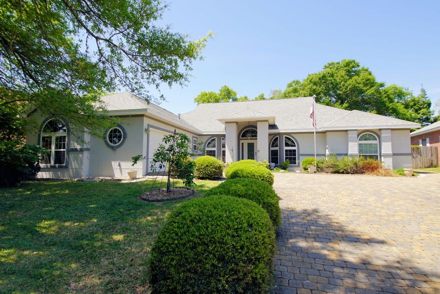 Custom built, one owner home with an enclosed pool in the sought after community of Lake Pointe in Shalimar. This home has been lovingly maintained and thoughtfully updated and is ready for its new owners! Driving up the beautiful paver driveway, you will be greeted by the gorgeous entryway that says welcome home. Entering through the wide foyer you will find the dining room to the left and a convenient office to the right. In front of you is the large family room with French doors leading to the enclosed pool beyond. The family room is open to the kitchen and breakfast nook. The kitchen has been updated with solid surface counters and lighting fixtures. There is plenty of counter space and an abundance of cabinets as well. This is a split floorplan with the master suite on one side of the