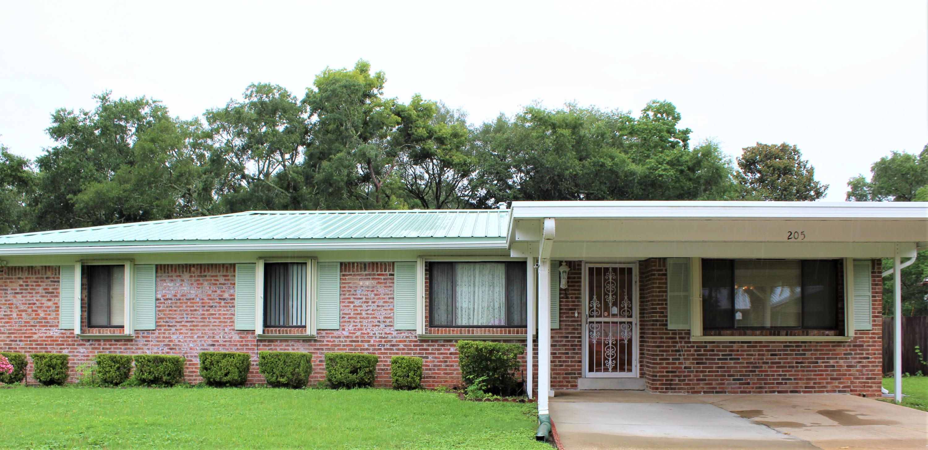 Don't miss out on this charming home in the heart of Niceville. You will walk into a sizable living room; to the right is a great family room. From the living room you will find a spacious kitchen with sliding door leading to a screened in porch. Down the hall you will find an adjoining full bathroom, two spacious bedrooms and master bedroom with adjoining full bathroom. New water heater & Whirlpool refridgerator 2021, roof 2019 & hurrican shutters 2006. More photos to follow. House in process of being rewired, ask agent for details. All room measurements to be verified by buyer.