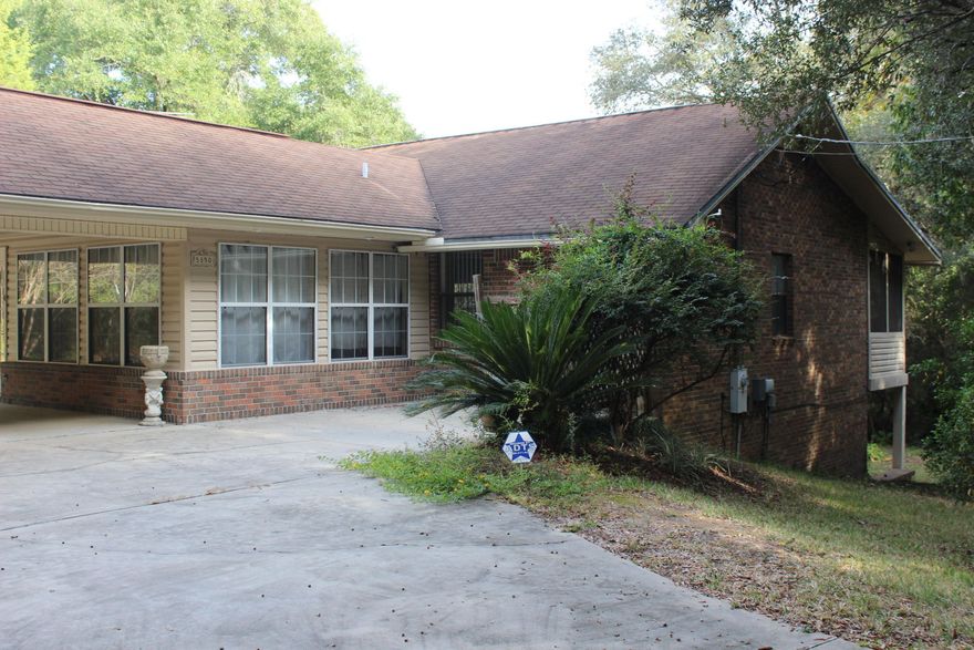 Dare to compare this Beautiful Private 2 acre Lake front Estate with lots of mature trees, detached Garage, close to schools, restaurants, and shopping. Enjoy the privacy and views of the beautiful lake stocked with Catfish, Brim and Bass. Kitchen has wall oven and a wood burning stove that will heat most of the upstairs area. Newer hot water heater, HVAC, sprinkler system, Downstairs is a great location for those dangerous storms to protect you, 16 x 18 Master suite, laundry room, and Bonus room that can be a Study or Craft Room. Wood stove that will heat mose of the downstairs. Large 8 x 48 screened porch, Circular Driveway, located on 3.29 acres