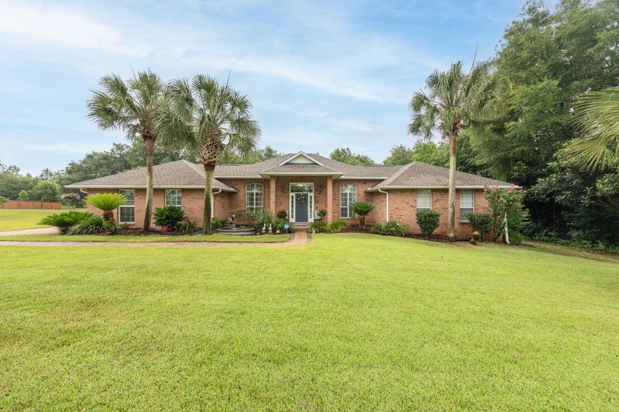 Welcome home to paradise! This home is move-in ready w/ brand new ROOF and WATER HEATER! This stunning property sitting on approx 1 acre South of I-10 with sparkling in-ground swimming pool w/ NEW LINER. As you walk into the inviting entry way which leads to spacious living room w/ fireplace and semi open floor plan. The stunning kitchen (renovated in 2017) boasts beautiful cabinetry, quartz countertops w/ tile backsplash, high end stainless steel appliances, pot filler and under cabinet lighting. Breakfast area and dining area adjacent to the kitchen. Large master en suite w/ renovated bathroom featuring all the extras including a tiled shower, jetted garden tub and dual vanities. An electronic wall panel controls your rain like shower head and the water source for your tub. Additional bedrooms on opposite side of home, both rooms feature built-in Murphy beds with great size walk in closets. Enjoy the Florida room with lots of natural light which leads to the backyard oasis w/ gas heated swimming pool and outdoor grilling area. This home is the perfect entertaining location. Other terrific features include an automatic gate leading into your backyard, deep well for the irrigation system with unlimited parking, RV parking with 50 amp service, storage shed w/ 1 car garage, and 3 smaller storage areas. Gutters around the home. New Carrier AC Unit in 2016. 6 New windows on the front of the home.  Don't miss your opportunity to own this piece of paradise! Schedule your appointment today.