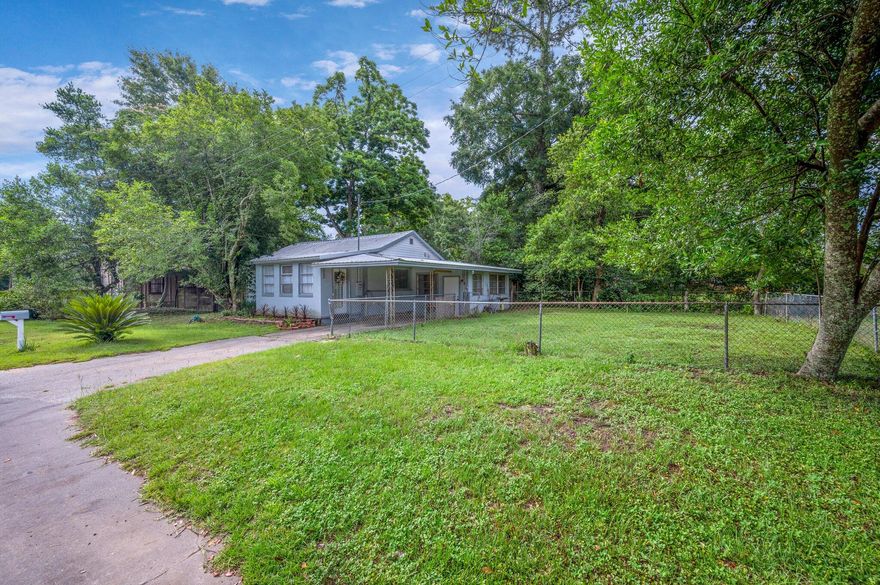Centrally located In the heart of Crestview, this 3 bd/1 ba home has lots of potential. Inside you are greeted with an entry room and spacious living room.  Cute and cozy kitchen that has character w/ vintage metal cabinets and a cast iron sink. The third bedroom needs flooring and has an exterior door to the carport which could make for a home office. The home could use some TLC, but has notable updates including roof (2017), HVAC (2010) and plumbing updates (replaced sewer line and all cast iron pipes with PVC in Jan 2022.) all per a recent 4 pt inspection. County site shows the zoning as MIXED USE. Buyer to verify zoning, school zones, lot dimensions, etc... for themselves. Nice level lot and chain link fenced area.