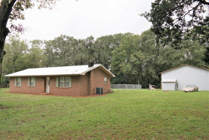 Great location just N of Florida State Line in Samson, AL.  Many updates to this home to include new roof in Jan. 2019; new flooring in Oct. 2021.  Home is located on apx. 1.5 acres with 30x40 shop on concrete slab with 80 gal, 5 hp 2 stage air compressor included. There is a fenced area in back yard for pets. Property boundary goes into the woods behind home, where there is a small creek running through back of property. This home is located apx. 1 hour from the beaches of South Walton and Panama City Beach.