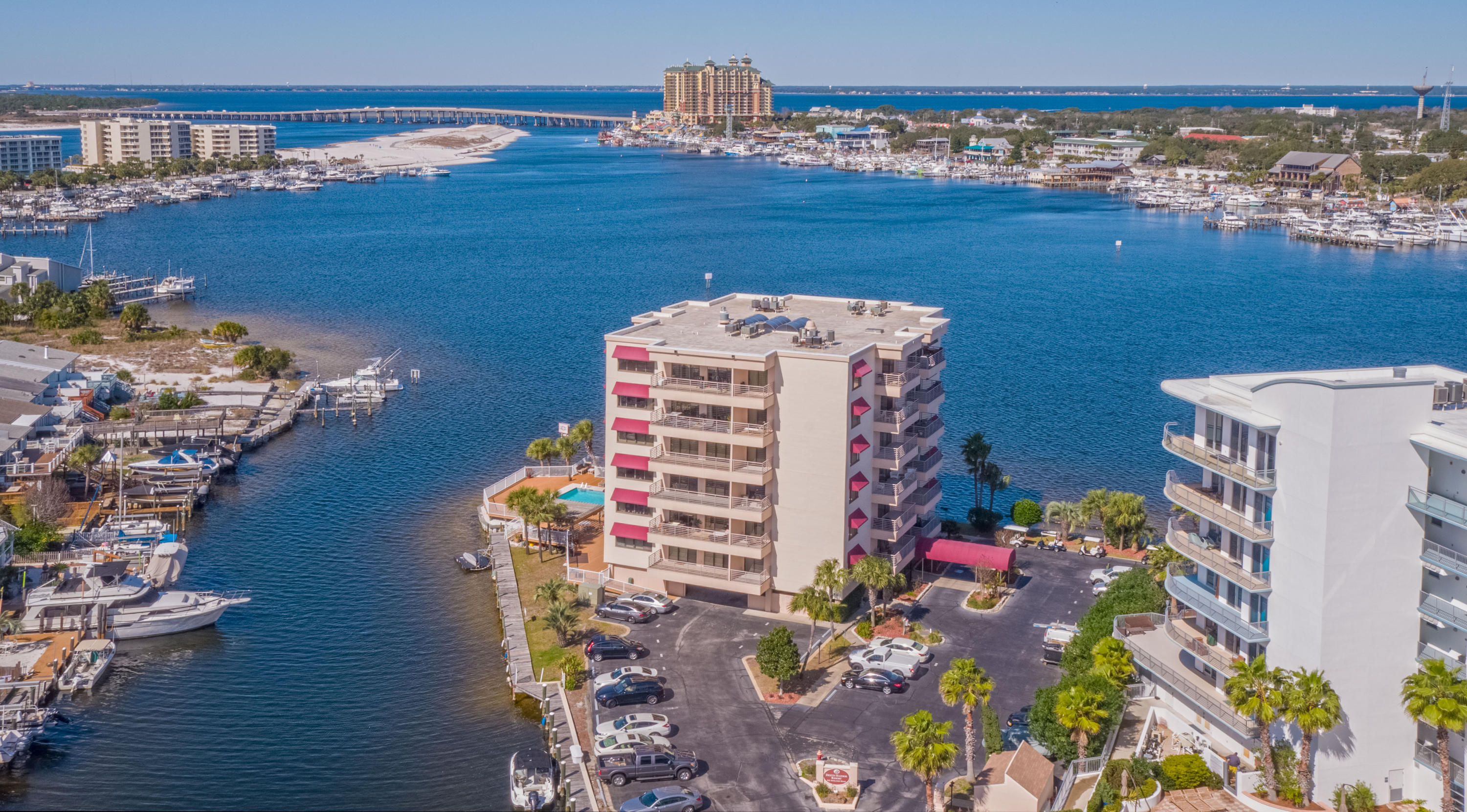 Outstanding opportunity to purchase a completely remodeled harbor front condominium with BOAT SLIP at Destin Harbor Resort West on Holiday Isle. The open floor plan is wonderful for entertaining. Impeccable tile work through out, trayed ceilings, crown mold, stainless appliances, granite, wet bar, and two balconies make this unit a must see for the discerning buyer. Gated for your privacy... large marina with fish cleaning station on the docks for the fisherman's convenience... and a small 24 unit low rise complex right in the heart of Destin. Boat slips are managed by the HOA. and based on the length and beam are assigned & guaranteed each owner. The Water Taxi is available for dining and shopping trips across the Harbor....and just 5 minutes to Crab Island and the Destin Pass out to