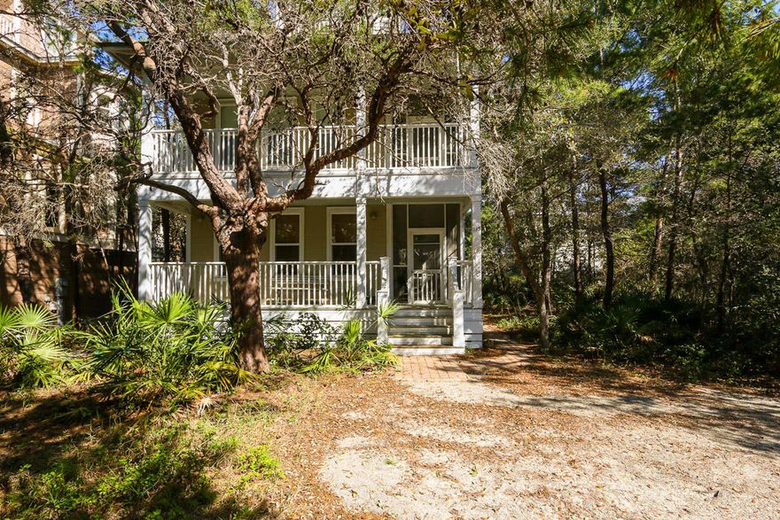 Absolute Old Seagrove Beach' charm! This elegant Florida cottage could not be in a better location. South of 30A and just a short stroll to the beautiful white sandy beach and Eastern Lake; this home is off the beaten path and surrounded by lush, native and indigenous flora. A fine feature of this home is 3 stories of wrap-around, screened and open porches. The 1st floor has a wrap-around porch that is open in the front and screened on the side. Lots of bright sunny windows, beautiful oak floors, open floor plan and high ceilings describe the main features of this home. The living room has a large built-in entertainment area with a desk and a granite countertop. The kitchen is well equipped with an island that has a built-in smooth-top stove, oven and microwave. All appliances a