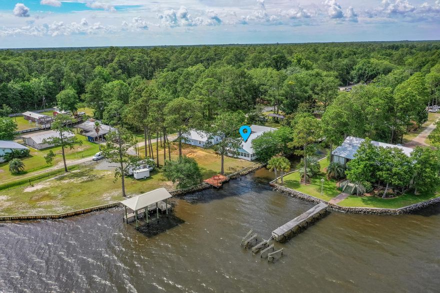 LIVE THE WATERFRONT & BOATING LIFESTYLE WITHOUT THE HIGH WATERFRONT PRICE. Offering 2 Homes: a completely renovated 3 BR/2BA home w/incredible water views plus a 1BR/1BA separate apartment, secure the Bay front primary Home or 2nd get-away beach Home you've always dreamed while having the opportunity to earn rental income to offset costs.  Enjoy a day at crab island followed by dinner on the water B4 heading home to your beautiful, peaceful retreat. A gorgeous new kitchen, 2 new bathrooms, new LVP flooring, new paint, lights, plumbing fixtures etc.. allow you to relax, exhale & enjoy the view.  6 Year metal roof, updated copper electrical & updated copper/PEX plumbing provide peace of mind. With 120 ft water on .37 acres there's plenty of room for boats, water toys & pool if desired. A large side screened porch & front covered porch allow you to enjoy the Fl lifestyle.  Other features include 2 large living areas in main home w/amazing water views, large master BR w/new master bath, new carpet in master, newer windows, laundry room & large garage.  The 500 SF 1 bedroom, 1 bathroom apartment w/living room & kitchen has separate interest & is located away from the main house making it ideal for guests, live in relatives or separate rental.  Located just off of Hwy 20 between Niceville & Freeport, shopping, schools & restaurants are close by. At this price, it is possible to start living the waterfront lifestyle you've always wanted.