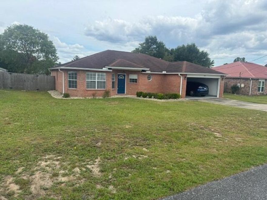 Conveniently located, south of I10, this spacious home boasts a split floor plan with 3 bedrooms/2 baths . This home features a large living room, dinning room  and an equally large eat-in kitchen with an island. However, if it's the outdoors that you prefer, you can entertain guests in the huge fenced backyard with screened in porch. This home has, sliding glass doors,  hardwood laminate floors & tile floors, GRANITE countertops in kitchen, with extra storage will be freshly painted. Master bedroom is large and so is master bath with large walk in shower and his and her closets on each side Washer and Dryer stay with unit but not warranted, Owner provides lawn care and pest control every other month. easy living and close to everything in town.