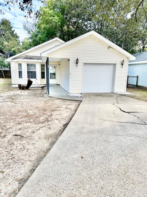 Clean & cute as a button, ready for its new owner! This would make a perfect starter home or investment property! Open living/dining/kitchen combo w/ parquet flooring. Black appliances in the kitchen. Carpet in the hallway & bedrooms. Inside utility closet off the hallway. Blinds & ceiling fans in all the rooms. Master has a 1/2 bathroom & door that leads out to the fenced backyard. Hall full bathroom has double vanity sinks. 1 car garage w/ an auto opener, door to the outside plus a BRAND NEW garage door. Great South FWB location, convenient to everything! Call your favorite Realtor to see today before you are too late, this one wont last long! 2013 Roof - 2016 HVAC - 2021 Refrigerator & Dishwasher - 2023 Stove/Oven & Water Heater PLUS a transferrable termite bond w/ FL Pest! WOW!