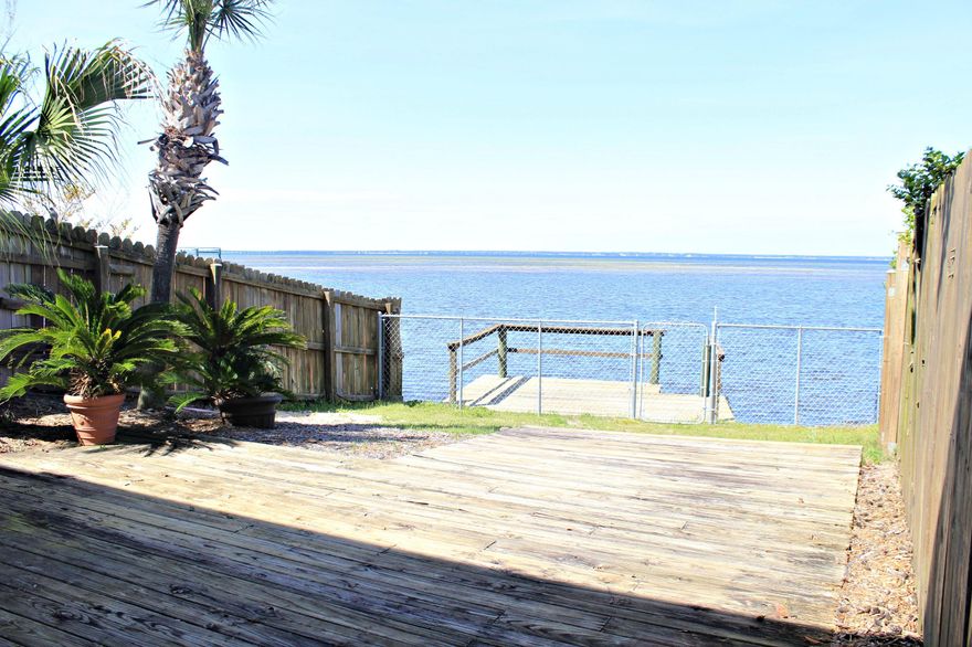 ****REDUCED****BAYFRONT TOWNHOME**** Great location and Unbeatable Price for this waterfront property. You will enjoy beautiful views of the Bay, or simply ride your bike to our amazing white sandy beaches. Get your boat, kayak or Yolo Board and hit the water. This town home would be perfect for the first time home buyer or also the investor looking for a great rental. Located minutes down the road from Silver Sands Outlet Mall, Destin Commons, and many amazing restaurants.