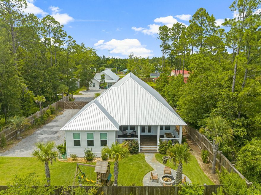 Welcome to your dream coastal getaway! A straight shot to public beach access - Take your golf cart to the beach! Located 2 miles from the pristine beaches of 30A, this 2022 build features an open concept, beautiful finishes, and a huge lot. With 3,761 square feet of meticulously designed living space, there's room for the whole family to spread out and relax. 4 large bedrooms, 4.5 bathrooms, front and back porches, fire pit, and plenty of room to put in a pool. Recessed lighting throughout, custom blinds, + more! Ample storage, ample parking (room for 10 cars, boat, RV, etc). Fully fenced backyard w/ mosquito Joe system & irrigation system. NO HOA!