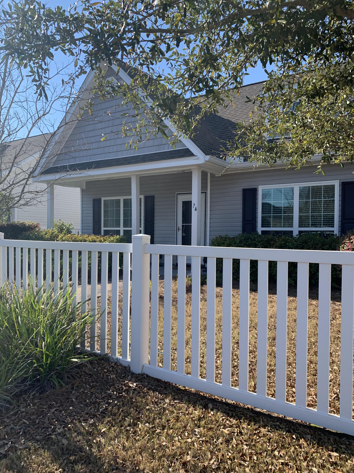 Walk or bike to the pool, clubhouse, and general store from your open and bright home in Hammock Bay. Enjoy summer nights from your covered front porch with adorable white picket fence. With fresh paint and new LVP, your new home is move-in ready! The master bedroom and bath are spacious and the tray ceilings add to the open feeling. With a tiled backsplash in the kitchen and lots of pantry space, you'll find everything you need right here.INVESTORS!! The tenants would LOVE to stay and have a solid rental history.