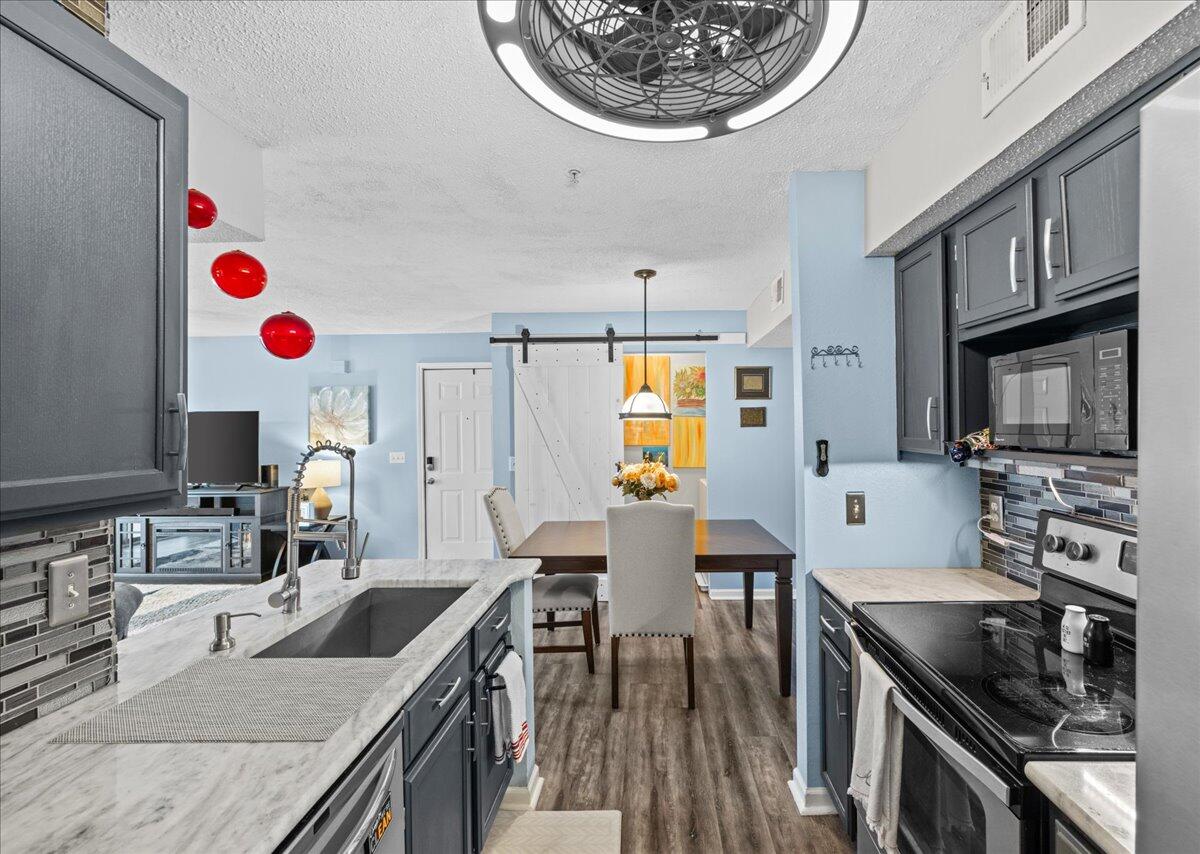 This beautifully maintained 2-bedroom, 2-bath condo is located in the heart of Destin, offering the perfect blend of comfort and convenience. This second-floor unit features 1,013 sq ft of bright, open living space with views of lush greenery--providing rare privacy and a peaceful setting. The spacious primary suite includes a walk-in closet, while the second bedroom offers generous storage. Enjoy community amenities like a pool, clubhouse, and gym, just minutes from Destin's gorgeous beaches, shopping, and dining. VA-approved and includes a home home warranty included for peace of mind! Similar units have done over $40K in short term rental income, in addition to being high-demand long term rental units - Ask the listing agent about rate buy-downs or closing cost assistance!