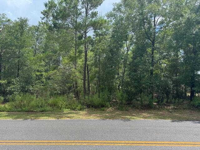 Looking to live near town but outside of the city limits? Take a look at this.... Vacant lot in an established neighborhood very convenient to town or for your commute. Power is in front of the lot, city water is available after tap fees paid, and septic tank will be required. This is a perfect lot to build a new forever home or place a manufactured home.
