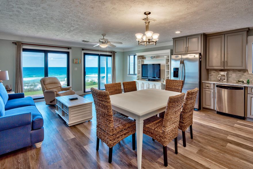 Coastal contemporary design characterizes this adorable gulf front condominium located in the heart of Destin's Crystal Beach. This unit has been beautifully remodeled and thoughtfully outfitted to maximize short term rental potential and take full advantage of it's West end ground floor location & stunning direct gulf views. Masterfully redesigned with a spacious open floor-plan this unit features new paint throughout, custom flooring, beautiful contemporary cabinetry in the kitchen and bathrooms as well as sealed calcutta marble countertops. The chef's kitchen features ample cabinet storage space, stainless steel appliances and opens to the ample sized living room. The master bedrooms features an en suite bath as well as a large closet space. The hallway bunk room was custom designed