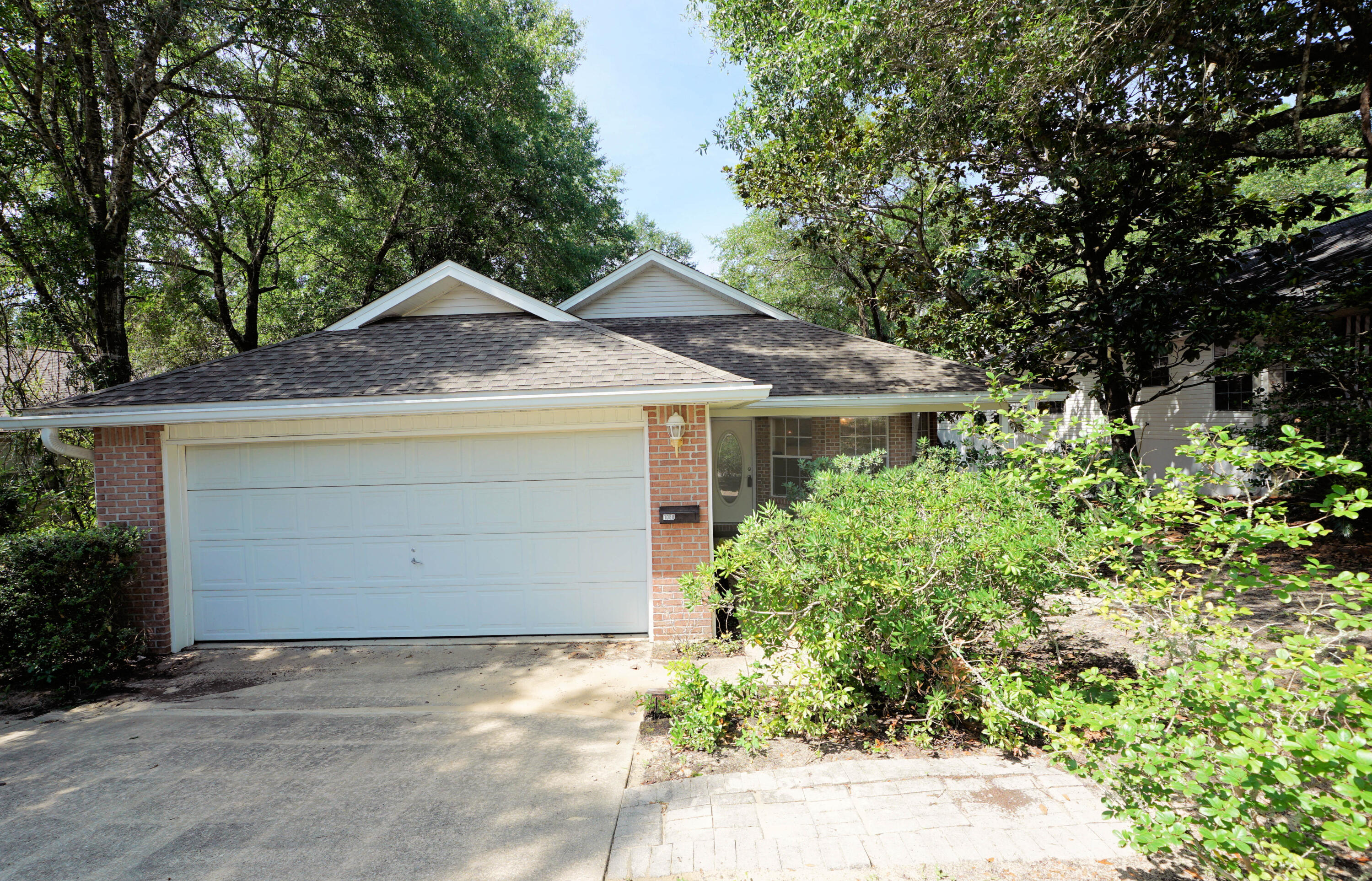 Quiet serenity awaits you in this custom home located on a wooded lot backing up to a delightful creek so you feel like you are living in a treehouse! When you enter this home, you will notice the custom arches leading to a light and bright greatroom with a vaulted ceiling and sliding glass doors leading to a covered porch and a huge wrap around deck along the back of the house making this the perfect place for outdoor living. The kitchen features a unique 'pass through' to the greatroom as well as plenty of cabinet and counter space. The master suite has an updated bath with a large shower and the additional 2 bedrooms share another full bath. This home is move in ready with fresh paint as well as new LVP and carpet. Practical notes: Water Heater (2025), Roof (2015), HVAC (2007)