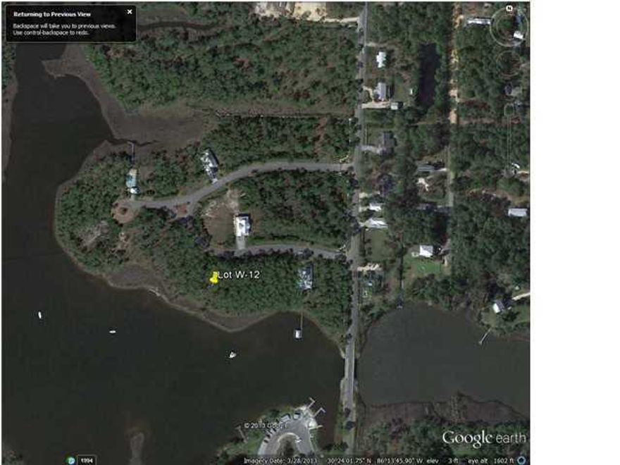 Great deep bay-front lot with 63' of water frontage and an amazing southwesterly view perfect for enjoying afternoon sunsets. Located within exclusive Gated community in historic Santa Rosa Beach. Water & sewer taps have been paid & are included in price. Protective covenants allow waterfront owners to construct a private dock. Bring your jet skis, paddleboard, or boat.