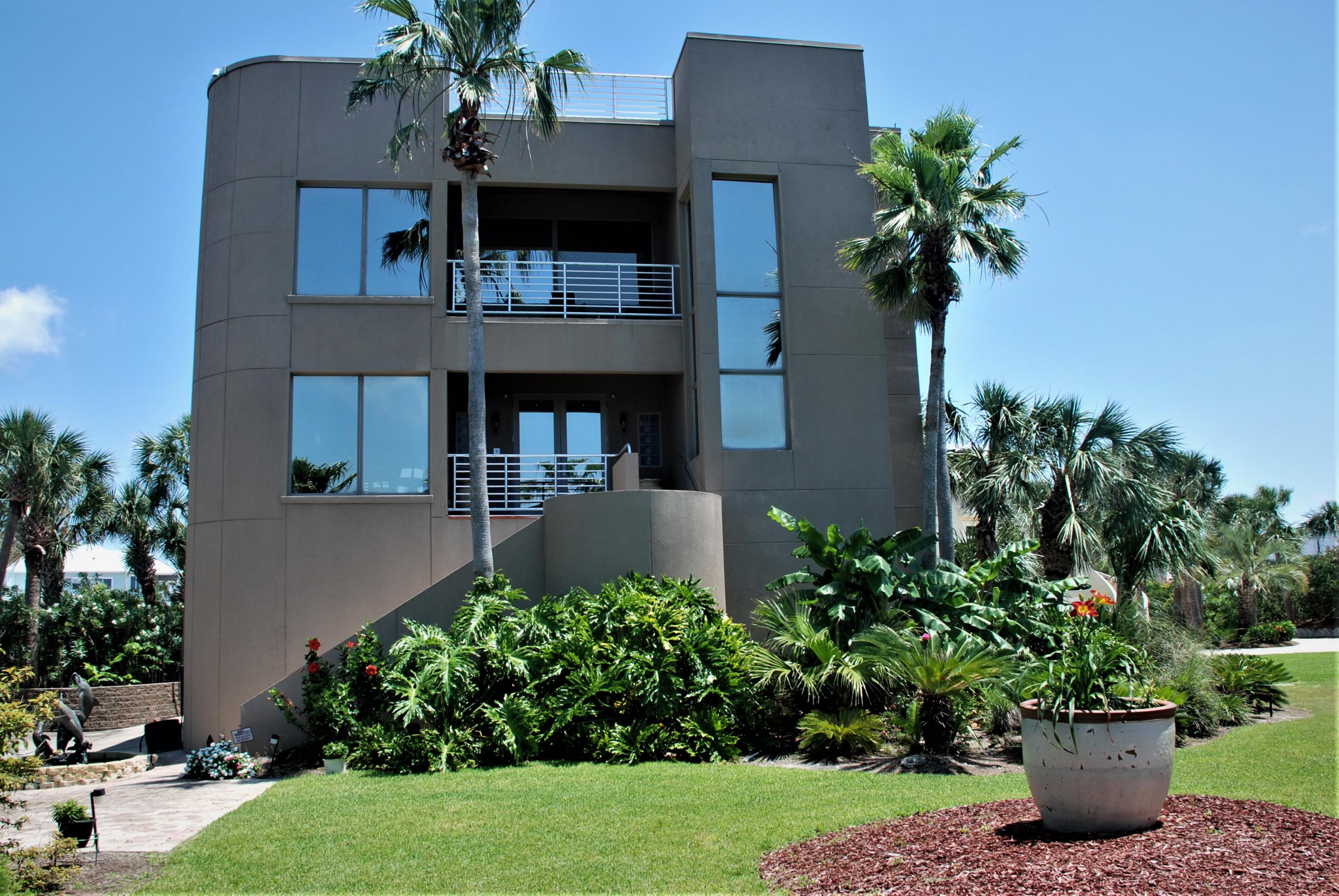 Sleek, contemporary gated private estate located on Destin Harbor & prestigious Holiday Isle. A family's oasis with a 14x30' heated pool, two deep water boat slips (one covered with lift)(could accommodate up to an 80'yacht), HOA deeded beach, rooftop terrace with sweeping gulf and harbor views. Master suite comprises entire third floor with, morning kitchen, capacious closet, office built-ins, sauna, washer & dryer, water closet, fireplace, elevator. 2nd floor makes entertaining a delight with large open floor plan containing a fabulous kitchen housing Sub-Zero refrigerator, Miele steamer oven, Gaggenau double oven, gas & electric cooktop with pot filler, Bosch dishwasher, extended counter-top with stools, dining room, living area with fireplace, built-in bar with ice maker, game area