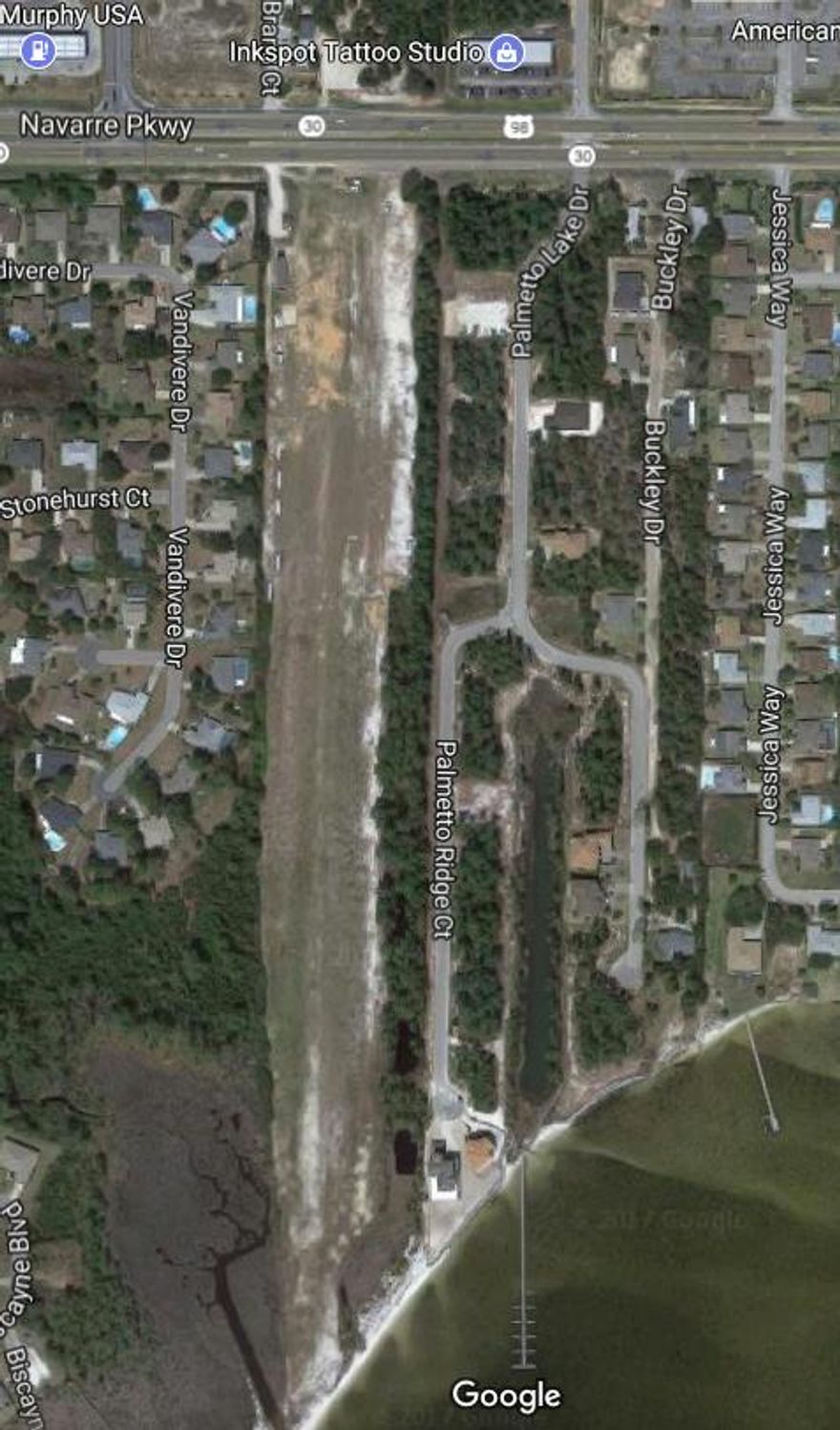 REO-Gated Waterfront Subdivision close to Hurlburt! Buy a lot and build your home in one of the nicest subdivisions in Navarre and only minutes away from both the air force base and beach! Lot financing and construction financing are available.